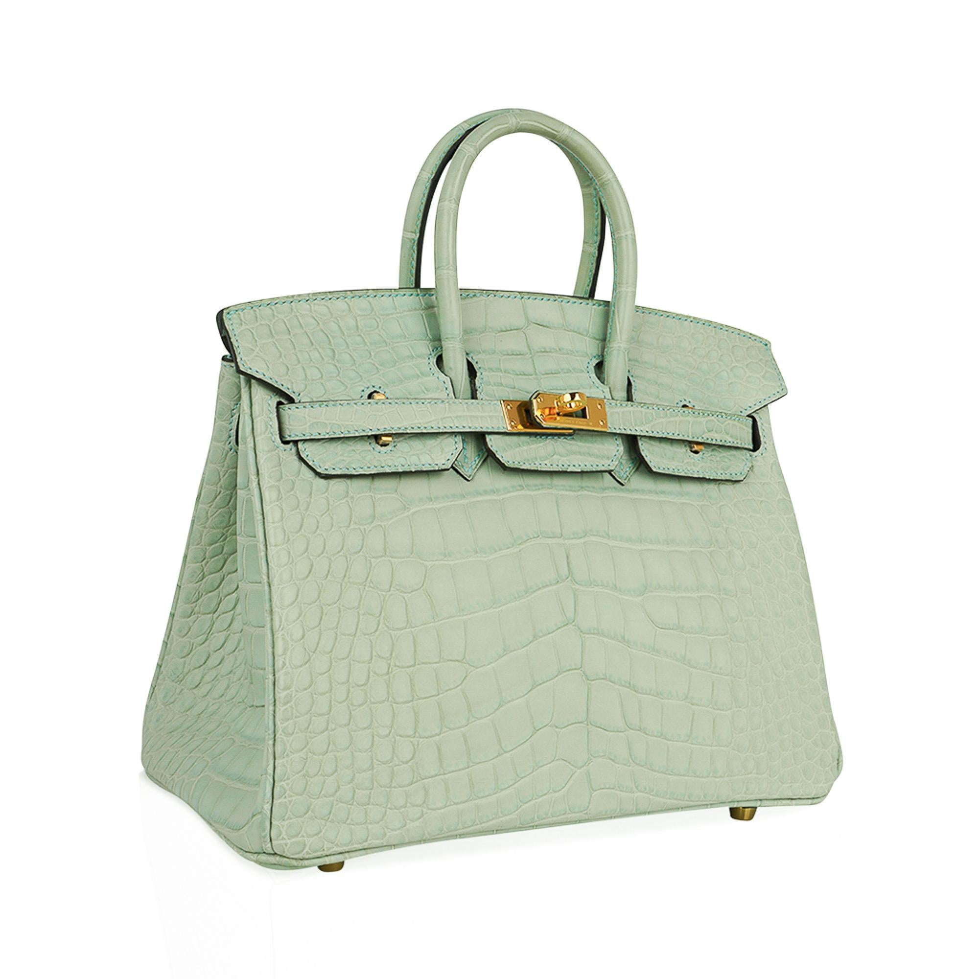 Mightychic offers an Hermes Birkin 25 Bag in rare Vert D'Eau is nothing less than translucent Caribbean water.
Breathtakingly beautiful this limited edition colour Hermes Birkin bag is a testament to the Hermes World of Colour. 
Matte Alligator