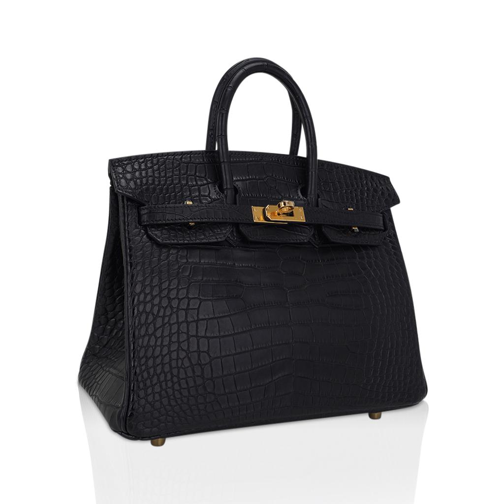Mightychic offers an Hermes Birkin 25 bag featured in Matte Black Alligator.
Rich with gold hardware this beautiful black alligator bag is chic day to evening.
Comes with lock, keys, clochette, sleepers, raincoat and signature Hermes orange box.
NEW