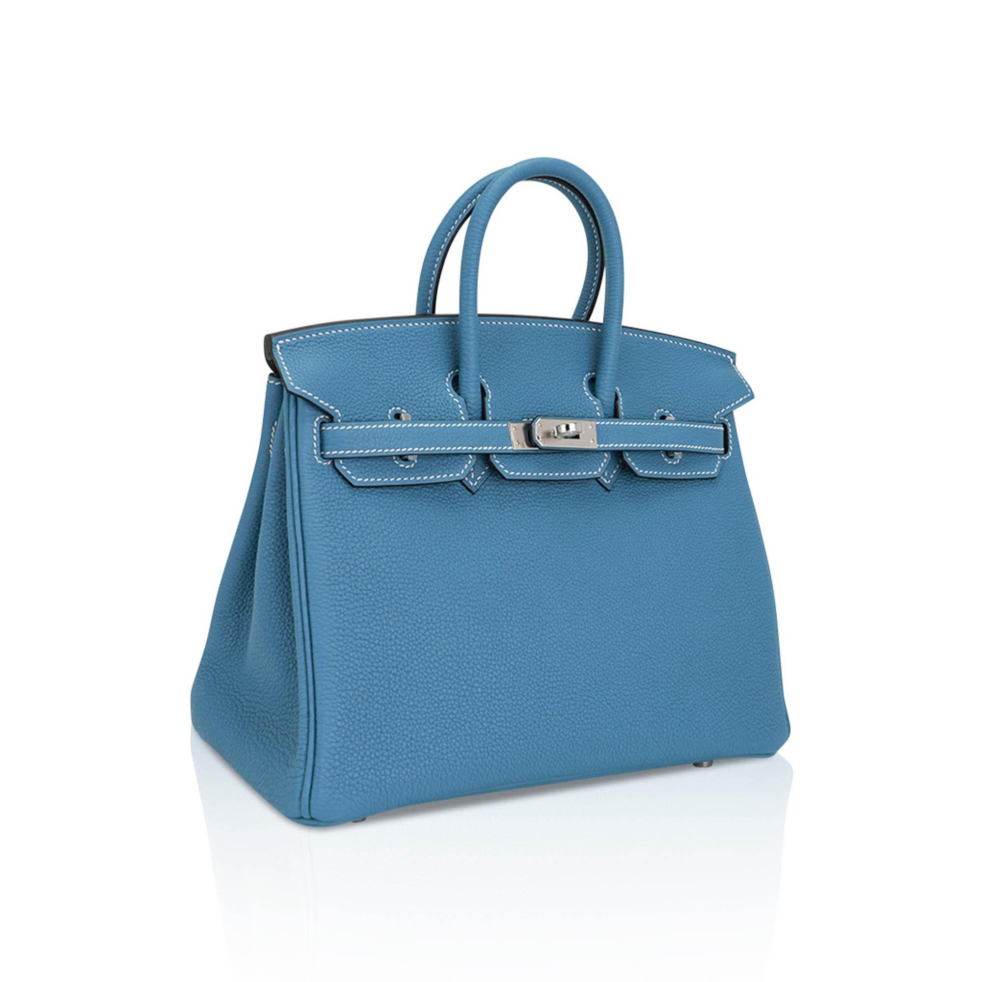Mightychic offers an Hermes Birkin 25 bag featured in iconic Bleu Jean.
Complimented with crisp fresh Palladium hardware and the signature white top stitch.
Togo leather is scratch resistant.
This neutral Blue Jean Birkin is perfect for year round