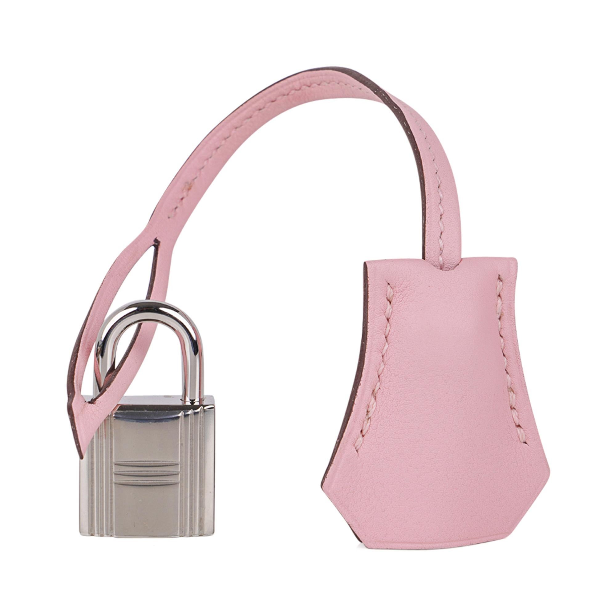 Mightychic offers a guaranteed authentic Hermes Birkin 25 bag featured in elusive Rose Sakura.
Gorgeous cherry blossom pink in swift leather. 
Soft with palladium hardware.
NEW or NEVER WORN  
Comes with the lock and keys in the clochette, signature