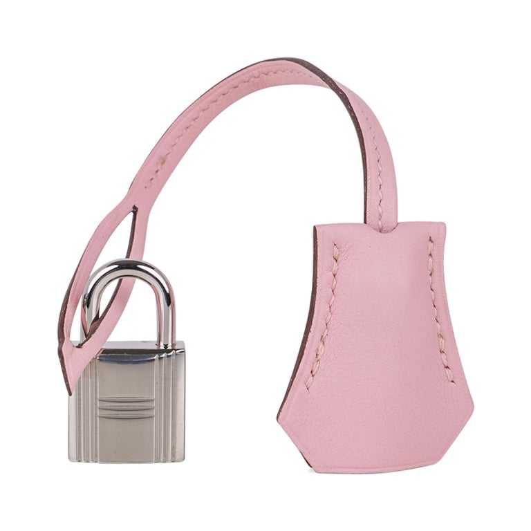 Mightychic offers a guaranteed authentic Hermes Birkin 25 bag featured in elusive Rose Sakura.
Gorgeous cherry blossom pink in Veau Jonathan leather. 
Soft with palladium hardware.
NEW or NEVER WORN  
Comes with the lock and keys in the clochette,