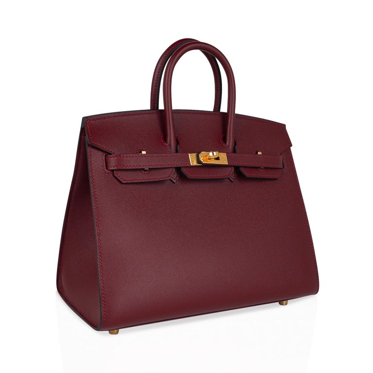 Mightychic offers an Hermes Birkin Sellier 25 bag featured in rich jewel toned Rouge H.
Veau Madame leather is absolutely gorgeous with a small flat grain and accentuates colours to perfection.
Lush with Gold hardware.
This exquisite bag is modern