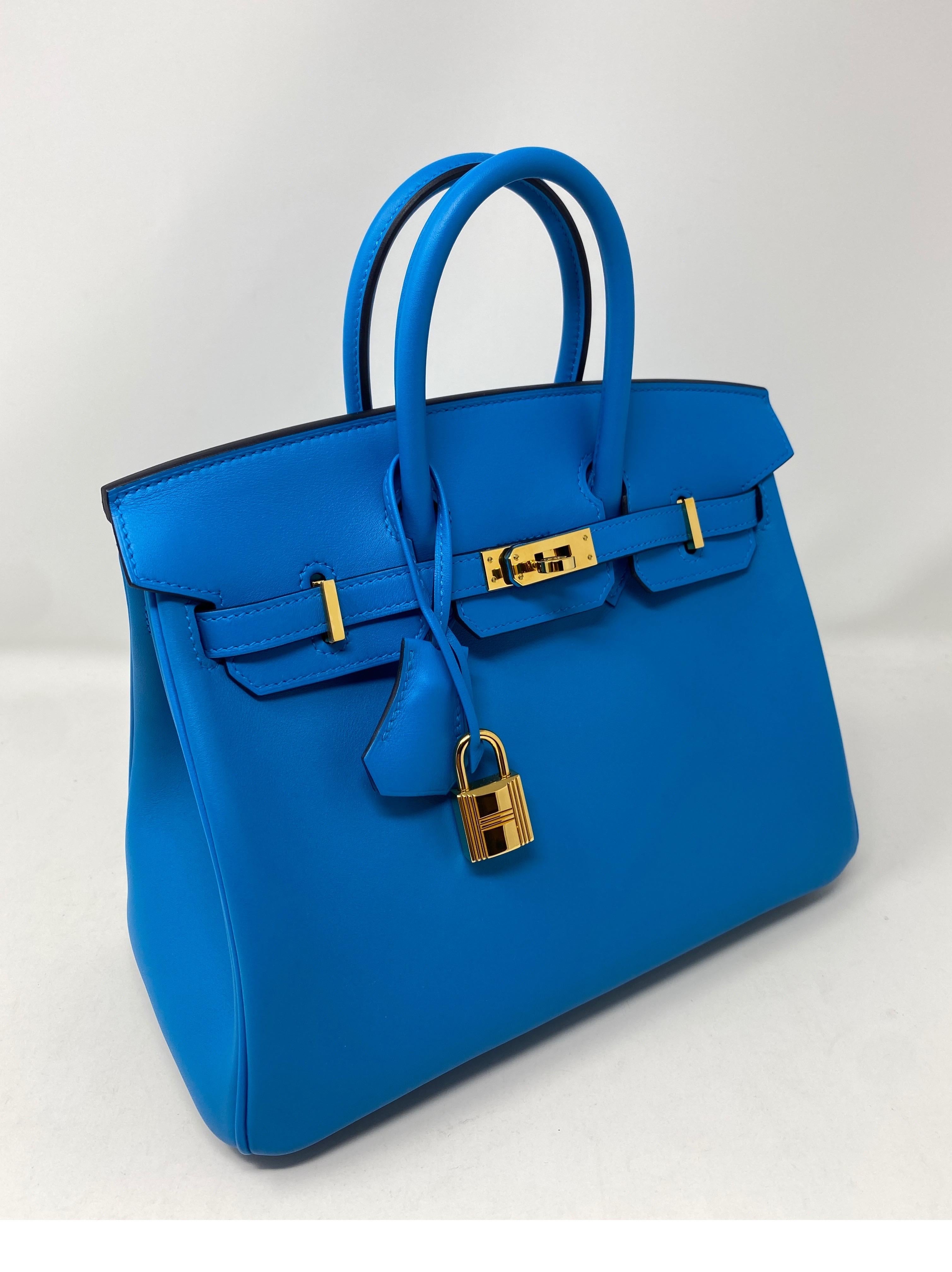 Hermes Birkin 25 Bleu Frida Bag in Swift leather. Most coveted size 25 that's almost impossible to find. Brand new., purchased 2021. Never worn. Gold hardware. Gorgeous, vibrant blue color. The unicorn bag of Hermes. Collector's piece. Full set: