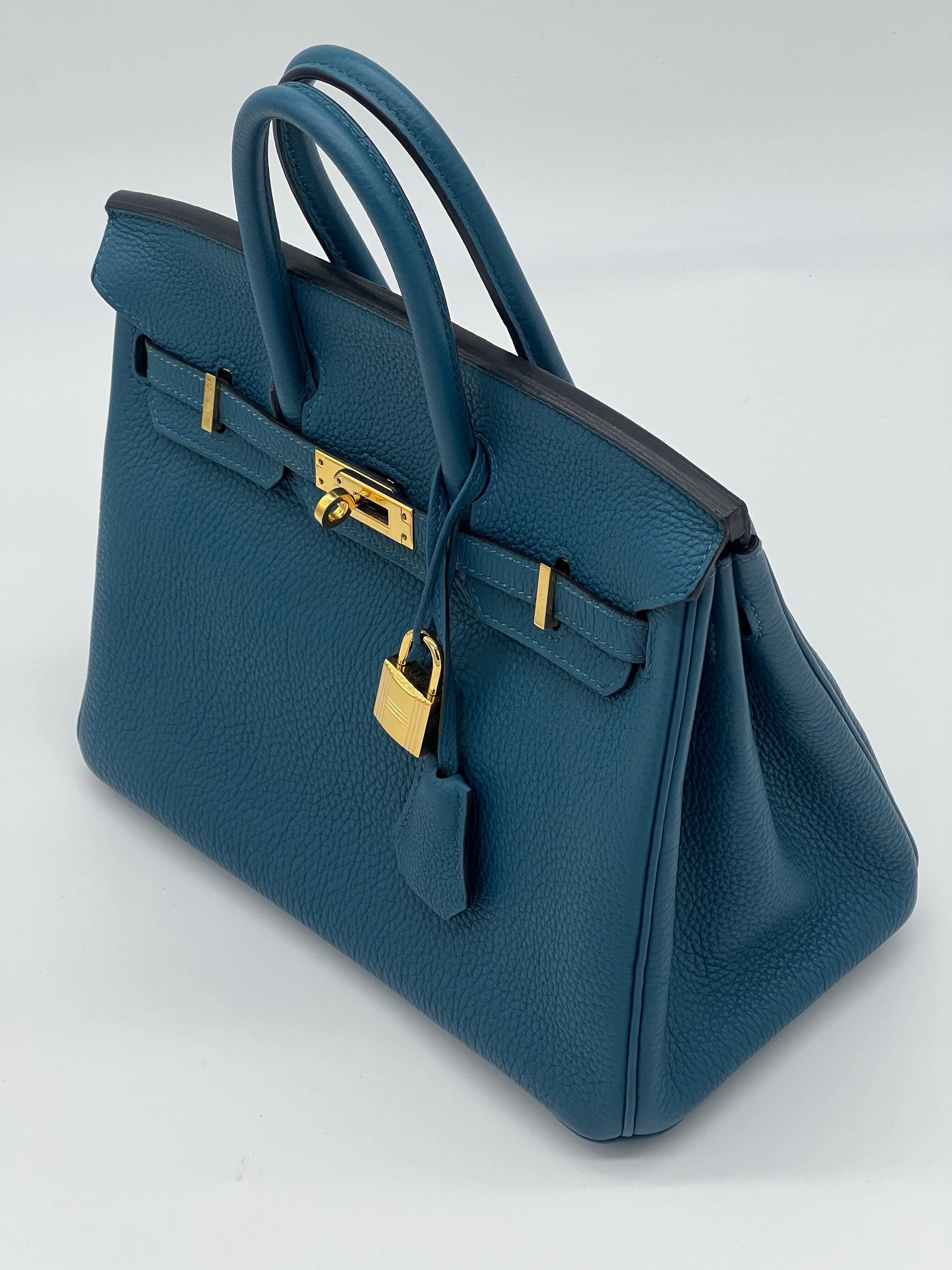 Hermes Birkin 25 Bleu Thalassa Togo Leather Gold Hardware

Condition: Pre-owned (like new)
Measurements:
Material: Togo Leather
Hardware: Gold plated

*Comes with full original packaging.
*Full plastic on hardware.