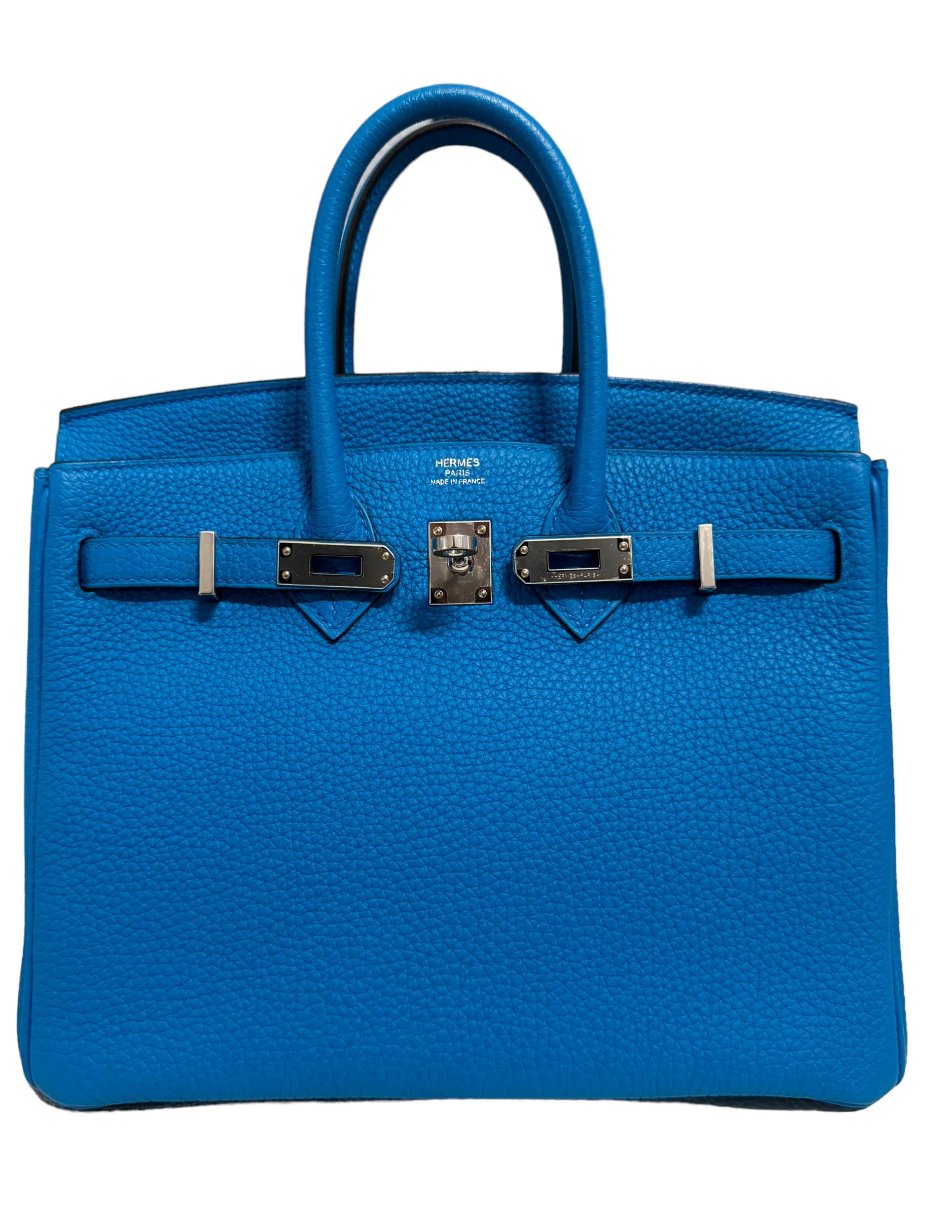 Absolutely Rare Stunning Highly Coveted Pristine Hermes Birkin 25 BlueZanzibar Togo Leather complimented by Palladium Hardware. Pristine Condition Plastic on Hardware, excellent structure and corners. Worn only a few times. From Collectors Closet.