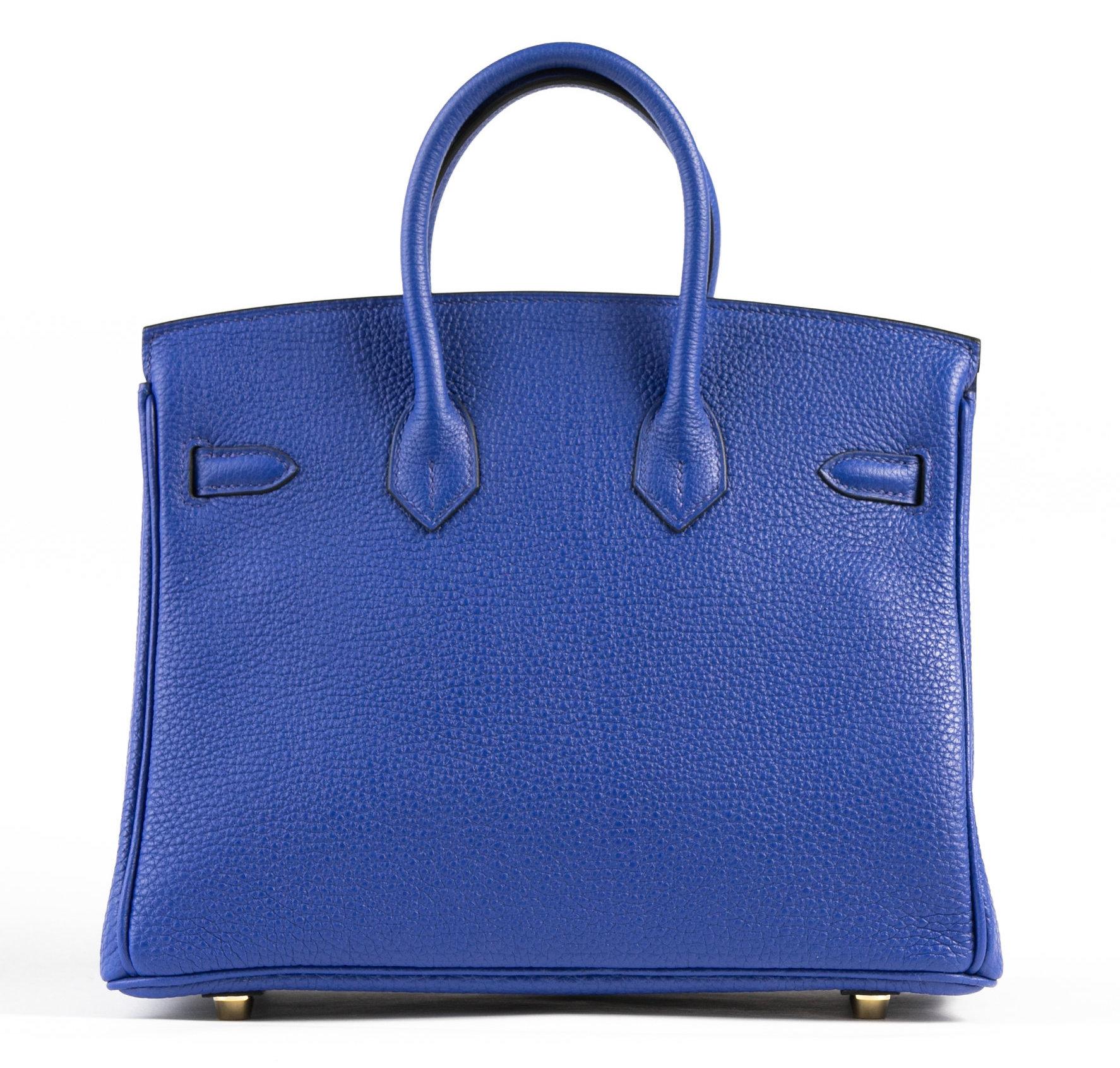 Hermes Birkin 25cm Blue Electric of Togo Leather with gold hardware.

This Birkin has tonal stitching, a front toggle closure, a clochette with lock and two keys and a double rolled handles.

The interior is lined with Chevre and has a zip with an