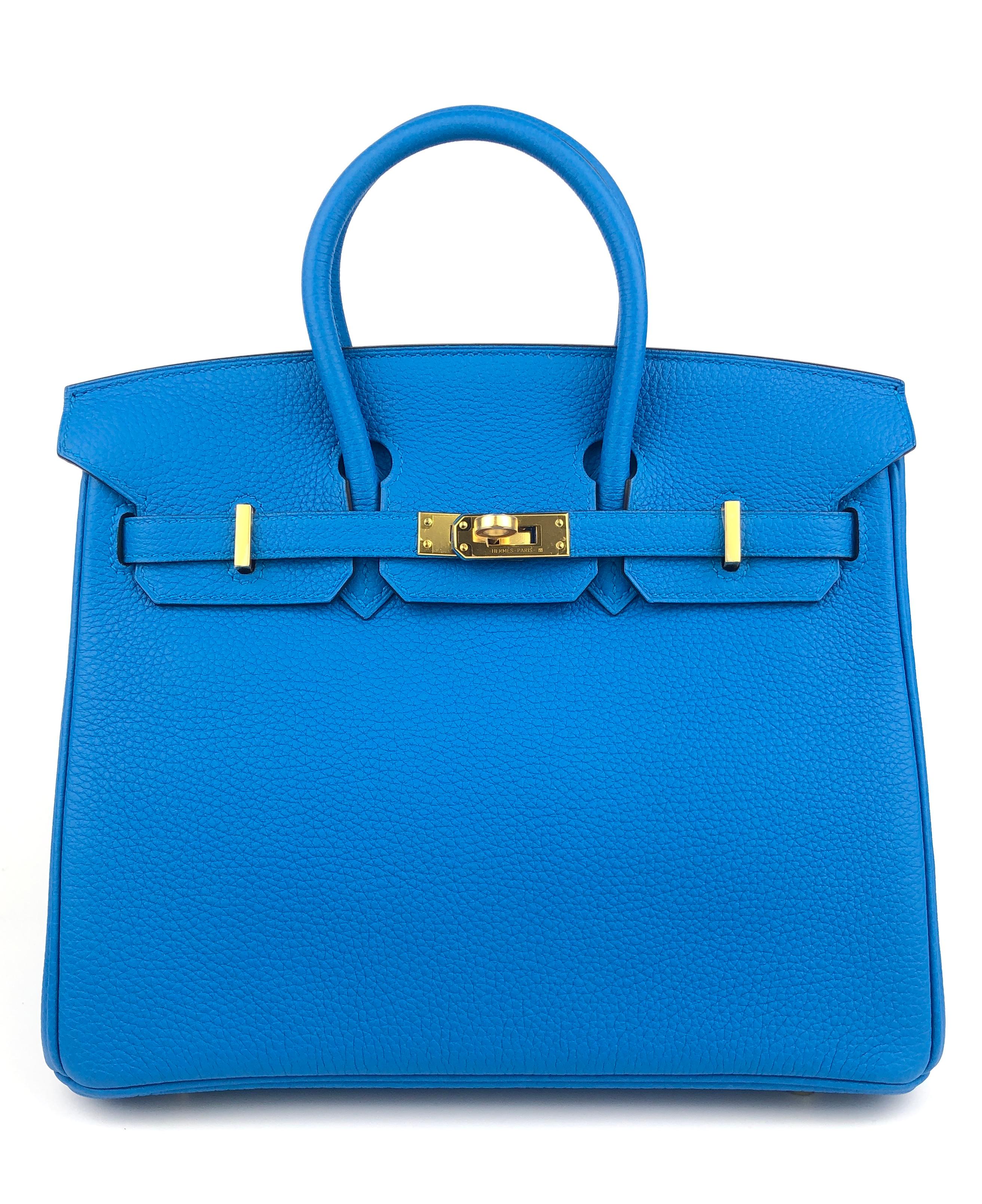 Absolutely Stunning Pristine Hermes Birkin 25 Blue Zanzibar Togo Leather complimented by Gold Hardware. As New Condition Plastic on all Hardware, excellent structure and corners. A Stamp 2017. 

Shop with Confidence from Lux Addicts. Authenticity
