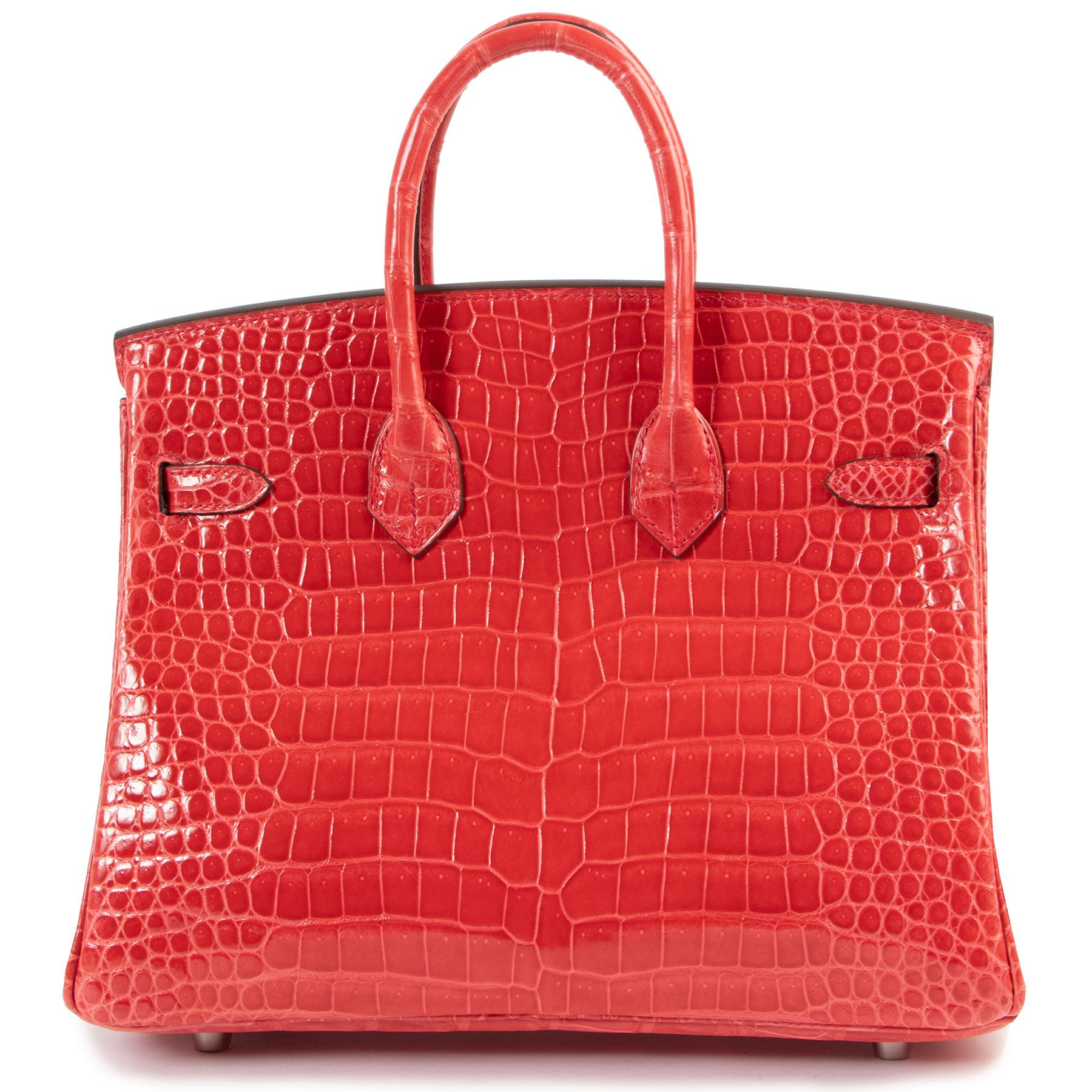 This VERY RARE & WANTED  Birkin is a real COLLECTOR'S ITEM.  
It comes in the very hard to find bourgainvillier color, which is a stunning cool red tone  and is made out of Porosus crocodile skin. Porosus is know for its scales which are smaller and