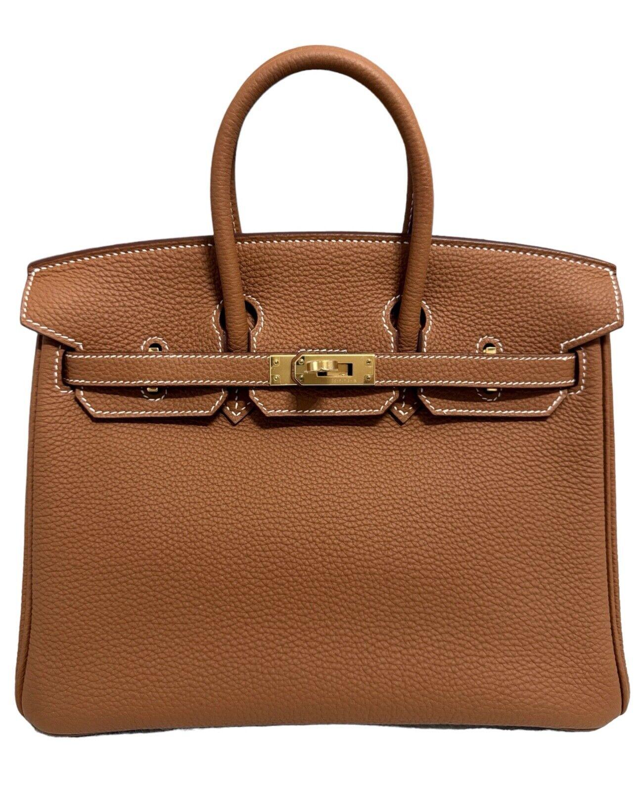 Absolutely Stunning and One The Most Coveted and Difficult to get Hermes Combos to GET! As New  Hermes Birkin 25 Gold Togo Leather complimented by Gold Hardware. Z Stamp 2021. Includes all accessories and Box.


Shop With Confidence from Lux