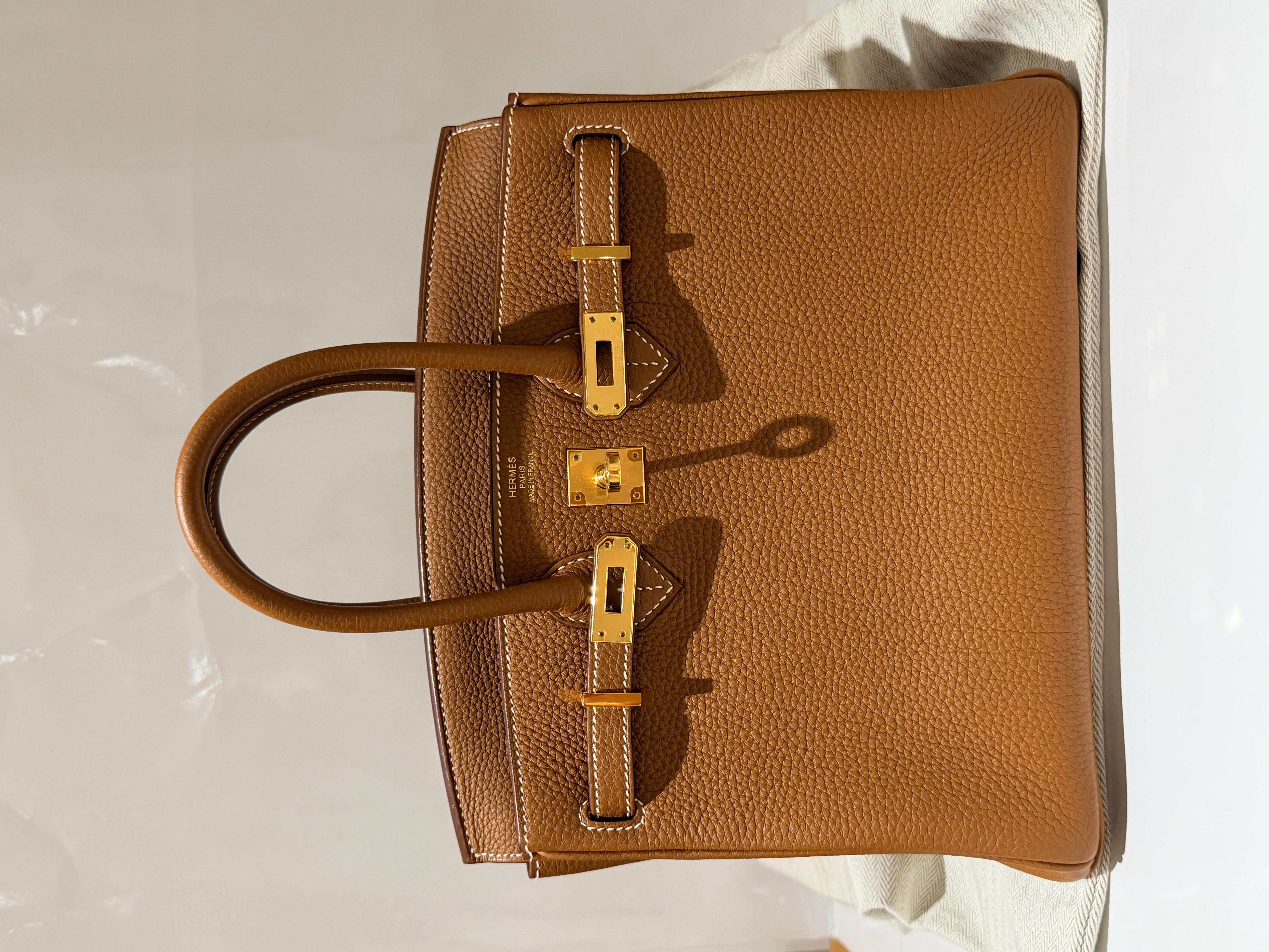 Hermes Birkin 25 Gold Togo Gold Hardware, K Stamp 2025, all sealed. A classic combo, iconic. Hermes understated sophistication and exceptional craftsmanship. 

New with box, dustbag, lock and keys. 

Measurements (W × H x D): 10