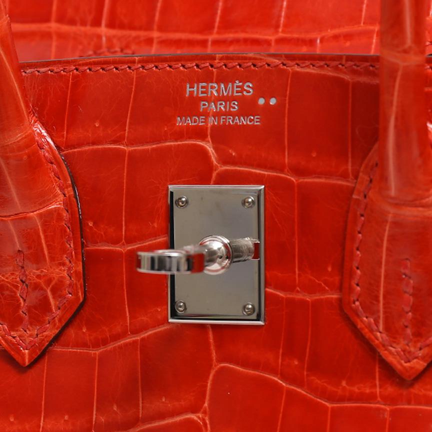 It Gets No Better Than This.

This incredible Hermes Birkin 25 bag is the ultimate status symbol for only the most discerning of Hermes collectors. Crafted of exotic crocodile skin and palladium tone hardware, this orange Poppy Hermes Birkin is in