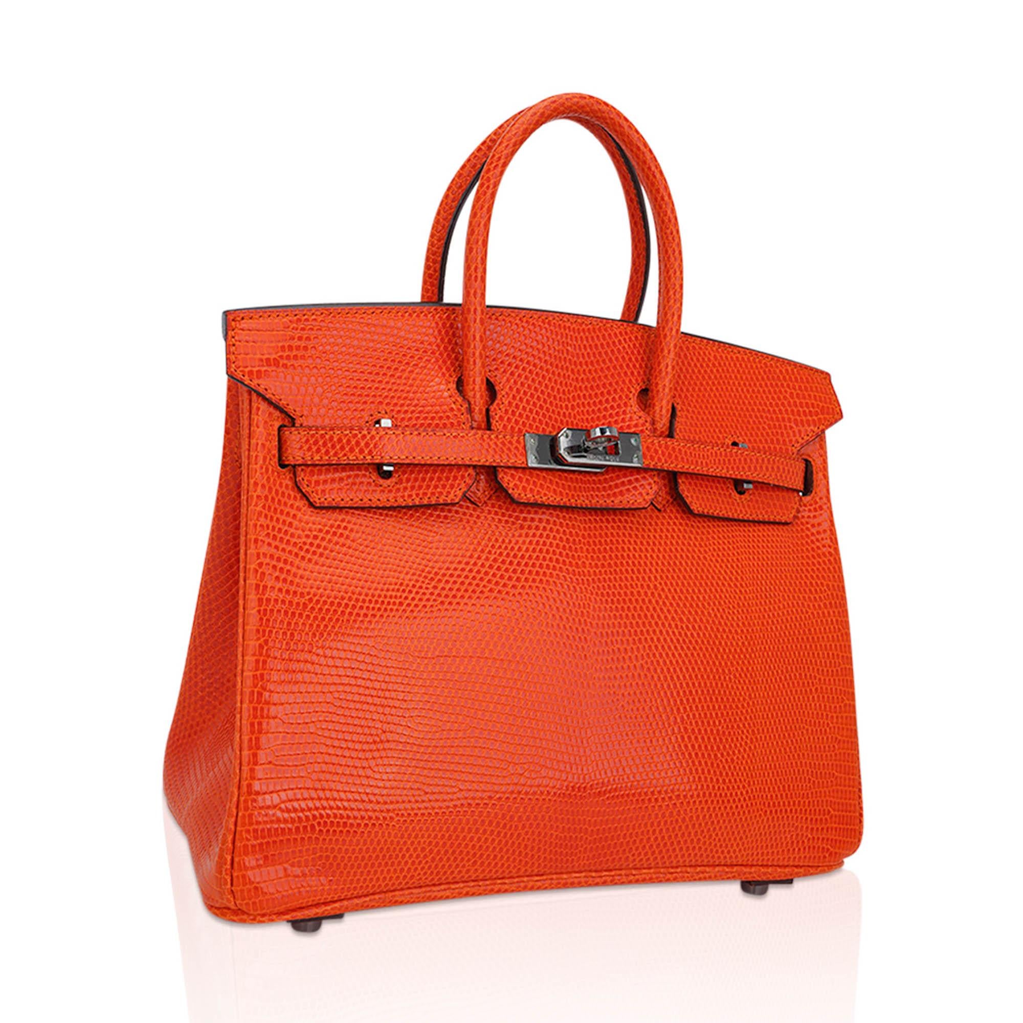 Mightychic offers an Hermes Birkin 25 limited edition vintage bag featured in Tangerine.
Stunning quench of Orange in coveted Lizard with rare Ruthenium hardware.
This beautiful exotic lizard skin Hermes Birkin bag is a collectors treasure.
Comes