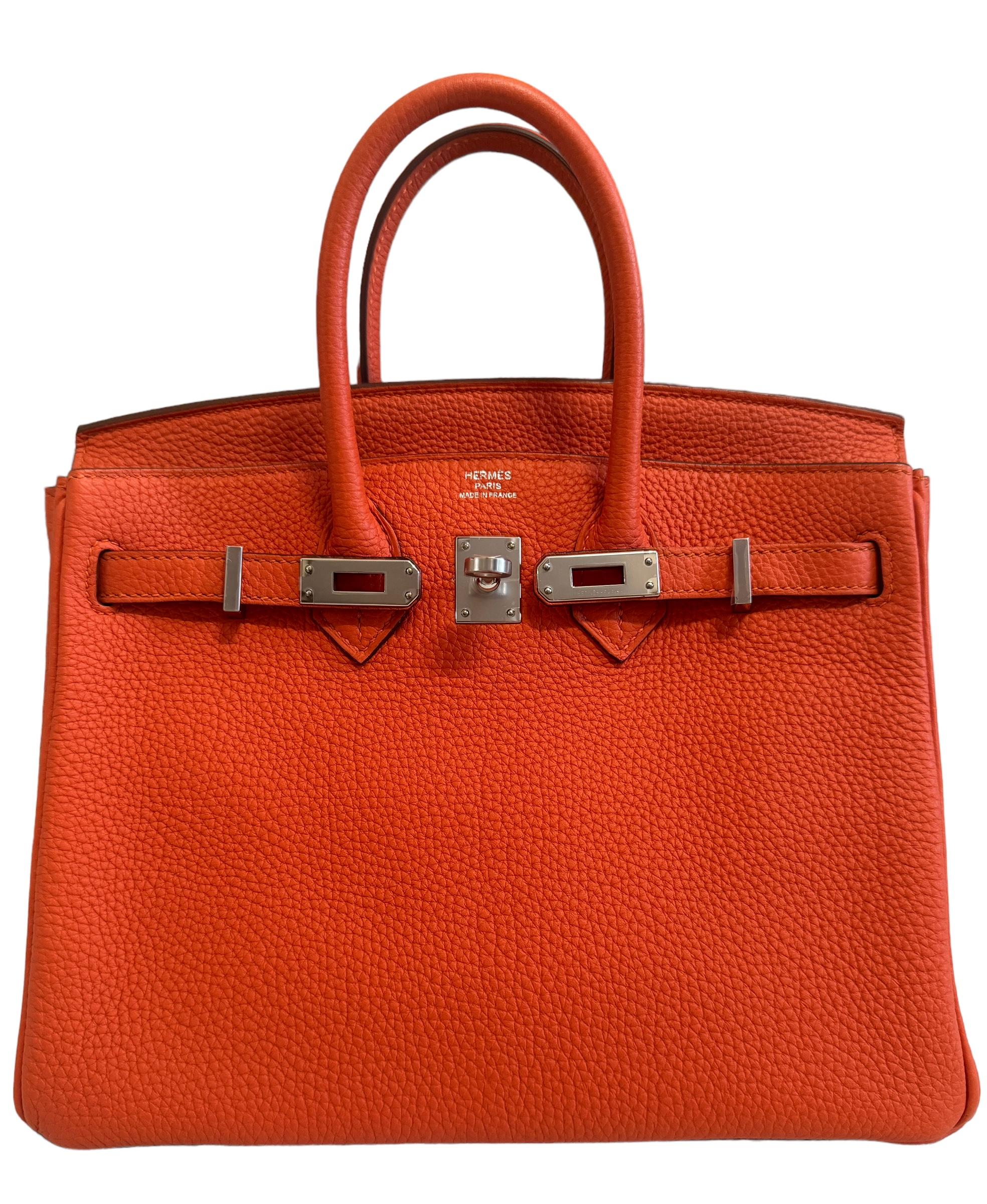 Stunning Hermes Birkin 25 Poppy Orange Togo Leather Complimented by Palladium Hardware. As New Pristine Condition with Plastic on Hardware, excellent corners and structure. 2019 D Stamp.

Please keep in mind that this is a pre owned item, the bag