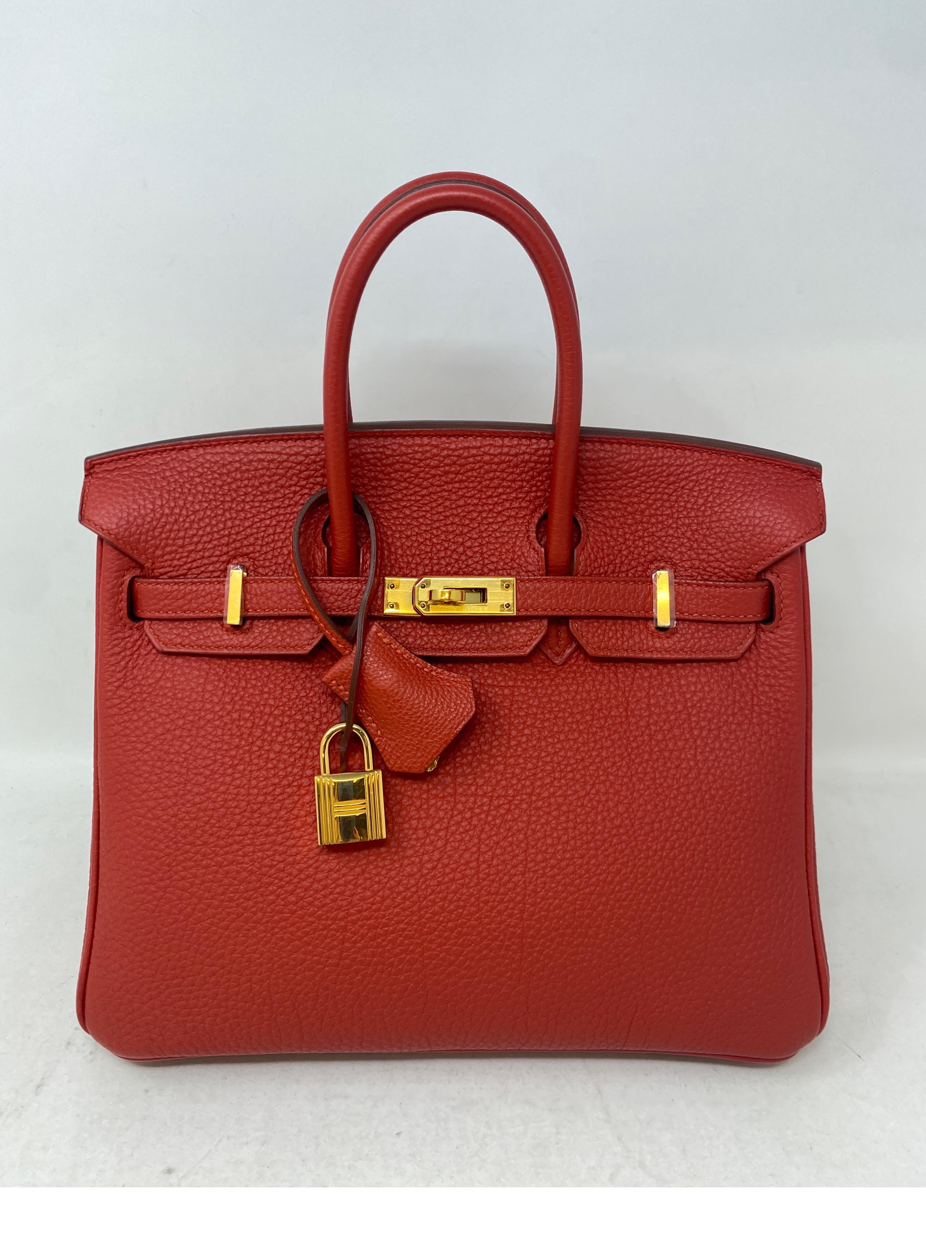 Hermes Red Birkin 25 Rouge Pivoine. Gold hardware. Gorgeous rare red color. Togo leather. Like new condition. Still has plastic on hardware. Highly coveted rare 25 size. Don't miss out. Includes clochette, lock, keys, and dust bag. Guaranteed