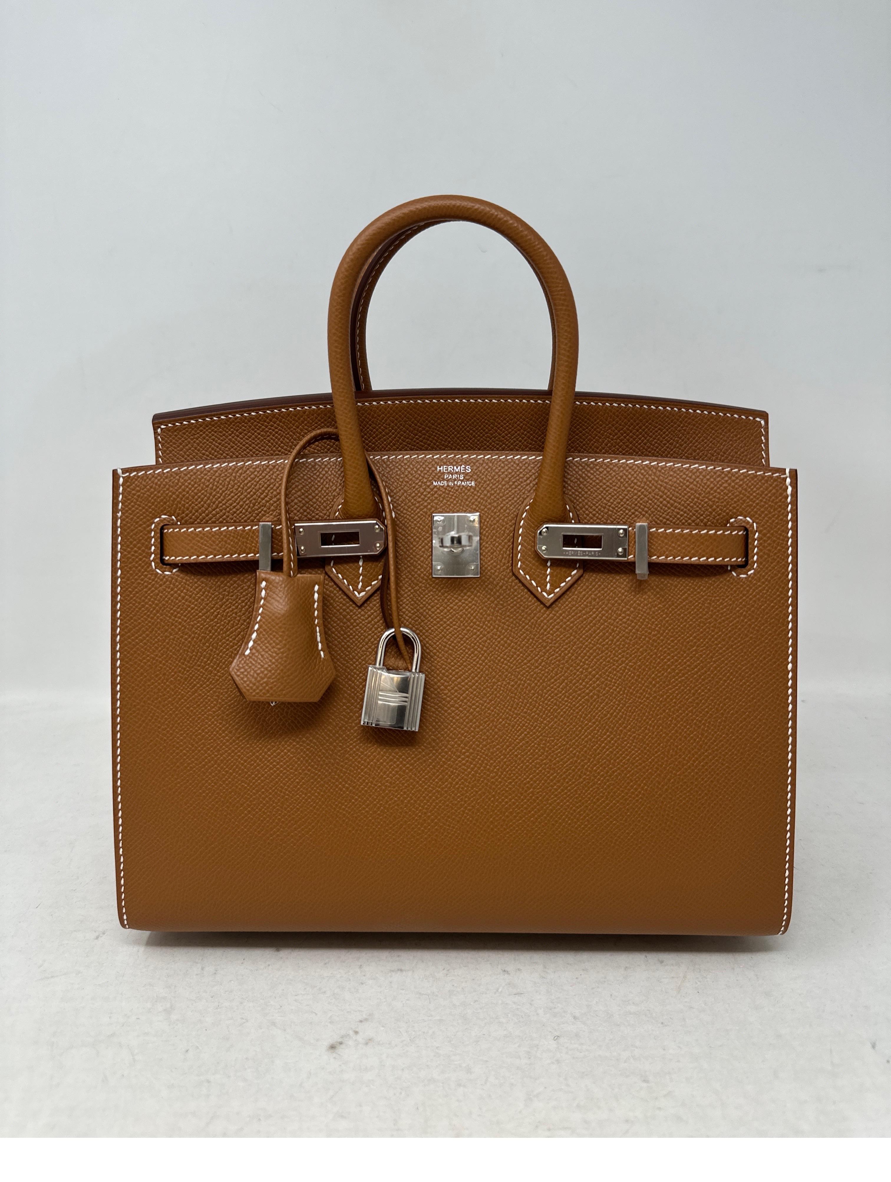 Hermes 25 Birkin Gold Sellier Bag. Palladium hardware. Excellent brand new bag. Plastic is on the hardware. Rare size 25 mini Birkin. Hard to get sellier. Beautiful gold tan color with white stitching. Great investment bag. Full set. Includes