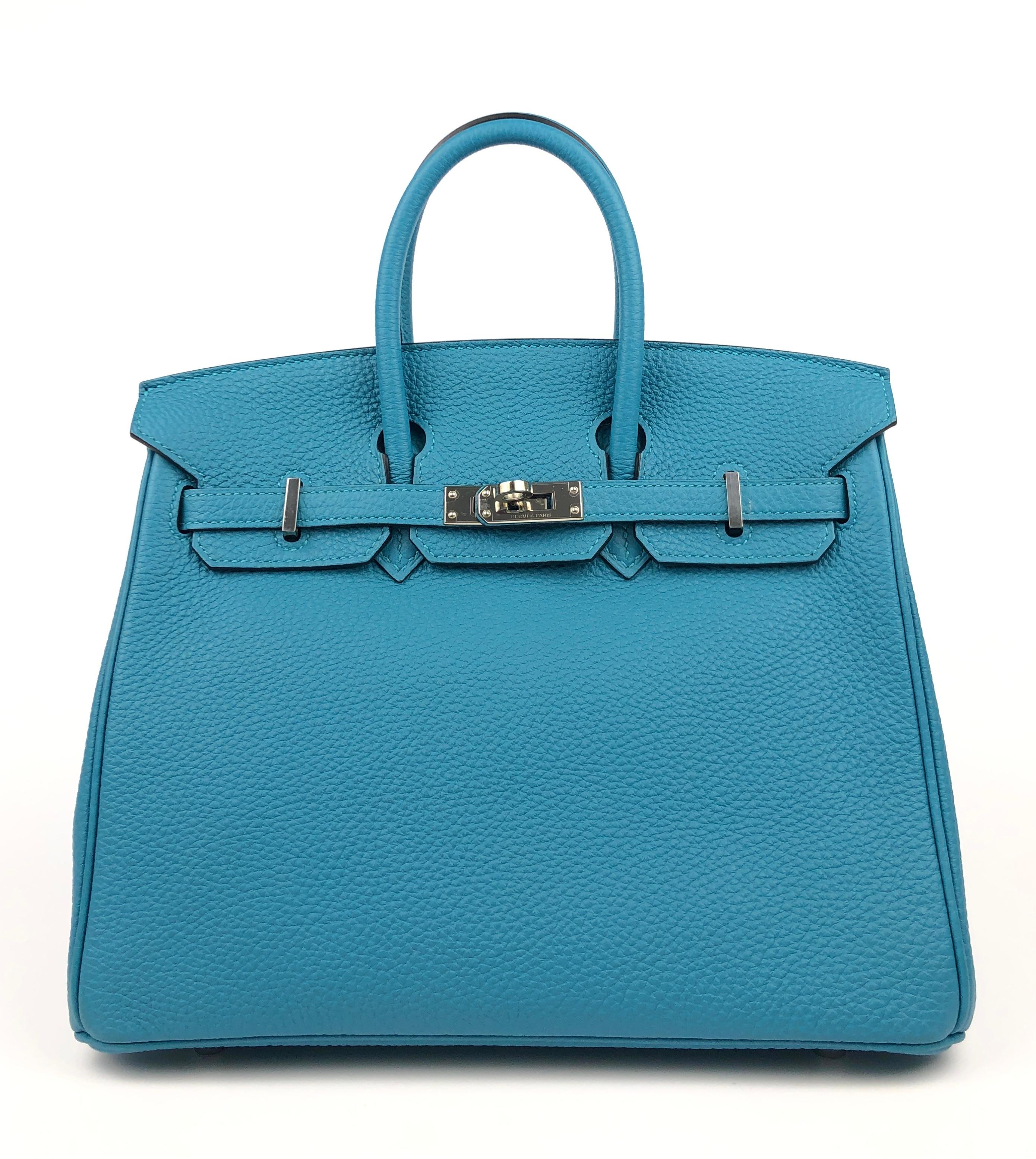Hermes Birkin 25 Turquoise Blue Togo Leather Palladium Hardware. Pristine Condition with Plastic on Hardware, perfect corners and structure. 

Shop with Confidence from Lux Addicts. Authenticity Guaranteed!