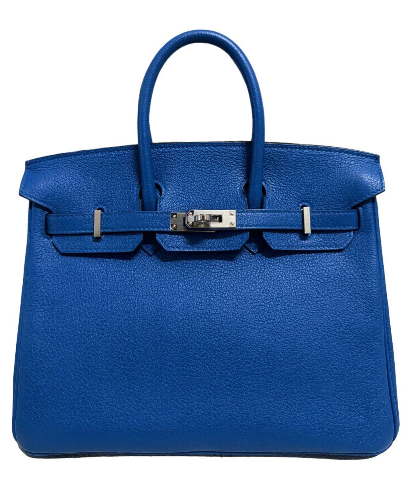 Absolutely Rare Stunning Highly Coveted Pristine Hermes Birkin 25 Verso Blue Zellige & Capucine Leather complimented by Palladium Hardware. As New Plastic on Hardware. Please see last photo which shows a slight mark on the bottom of the bag due to