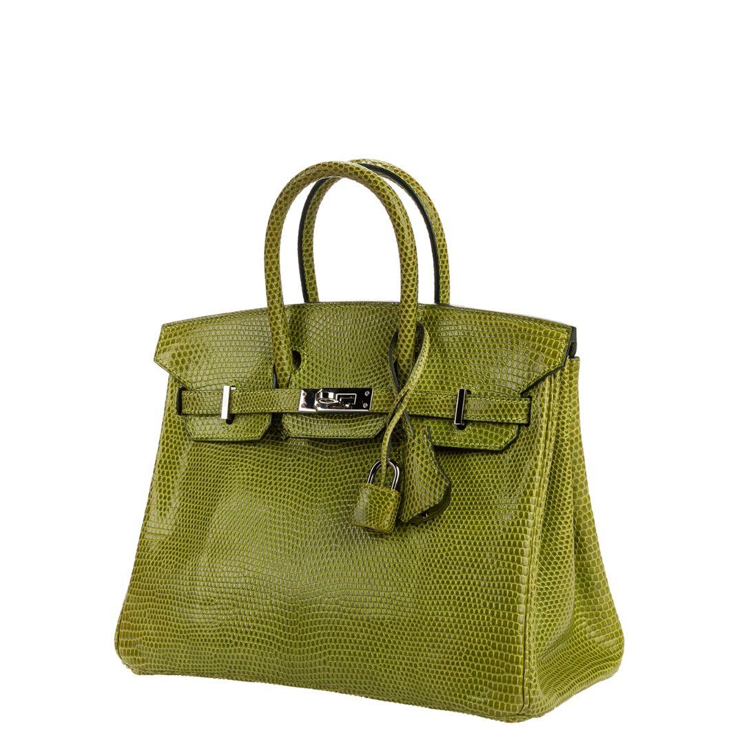 In impeccable condition, the size of this exotic and rare Birkin is amazing! It's the 25, meaning its the smallest size (Baby Birkin) and is absolutely a showstopper in the Glossy Vert Anis Green color. An Hermès Birkin 25, considered a Baby Birkin,