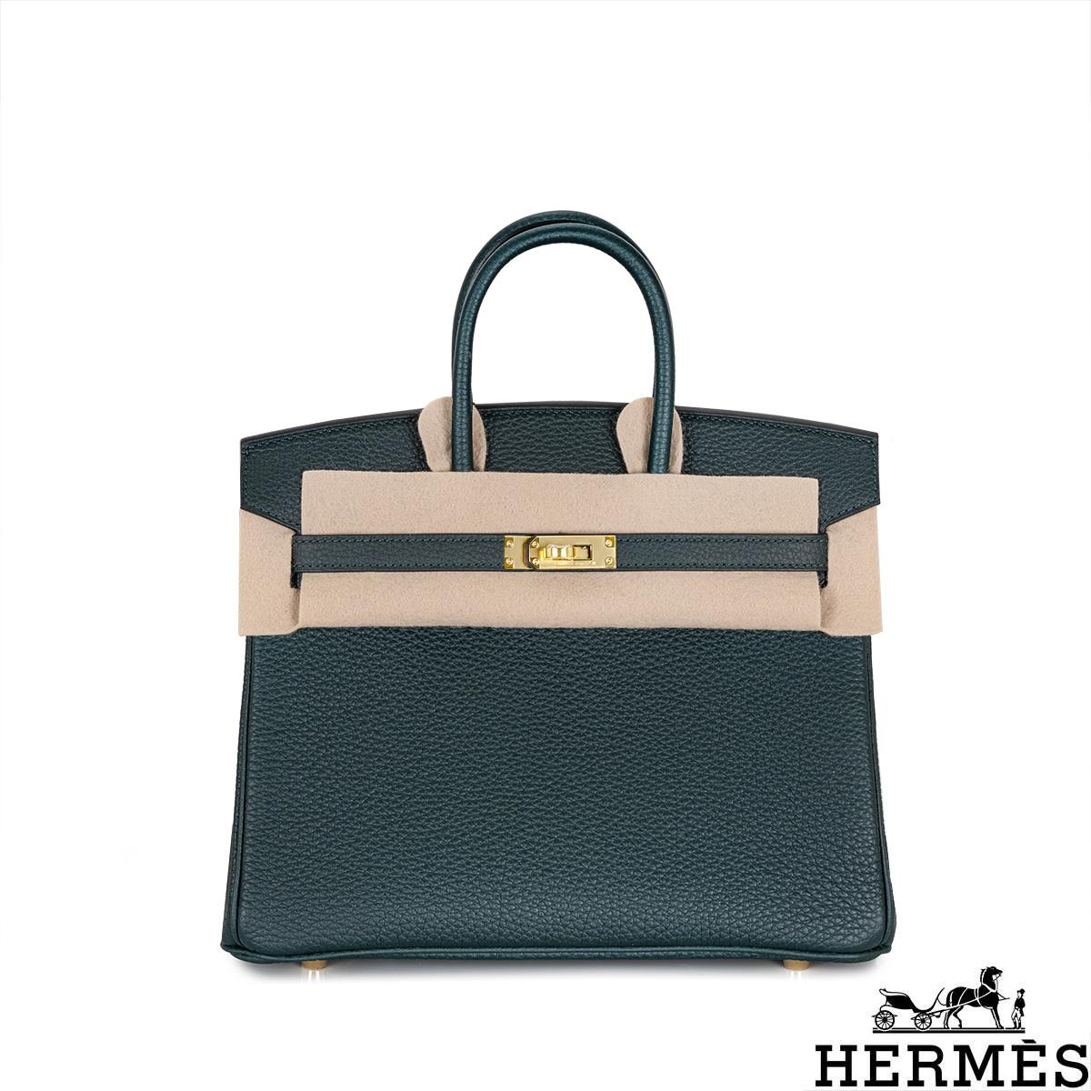 An amazing Hermès 25cm Birkin bag. The exterior of this Birkin is in Vert Cypress Togo leather with tonal stitching. It features gold tone hardware with two straps and a front toggle closure. The interior features a zip pocket with an Hermès