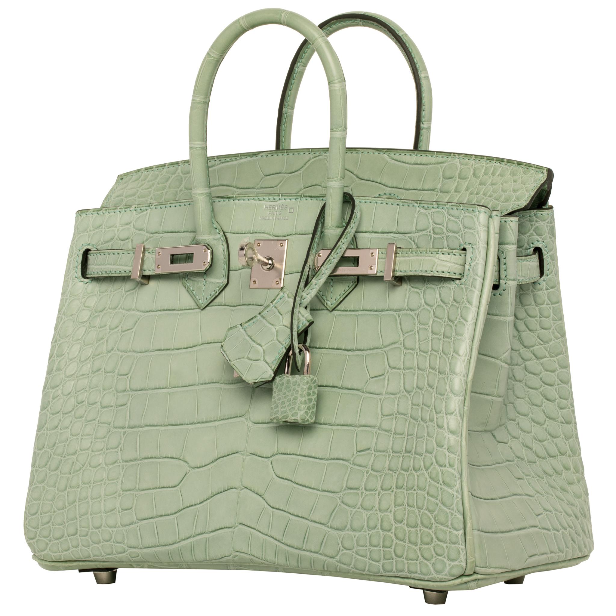 1stdibs Exclusives From Three Over Six

Brand: Hermès 
Style: Birkin
Size: 25cm 
Color: Vert D Eau
Leather: Matte Alligator
Hardware: Palladium
Stamp: 2020 D

Condition: Pristine, never carried: The item has never been carried and is in pristine