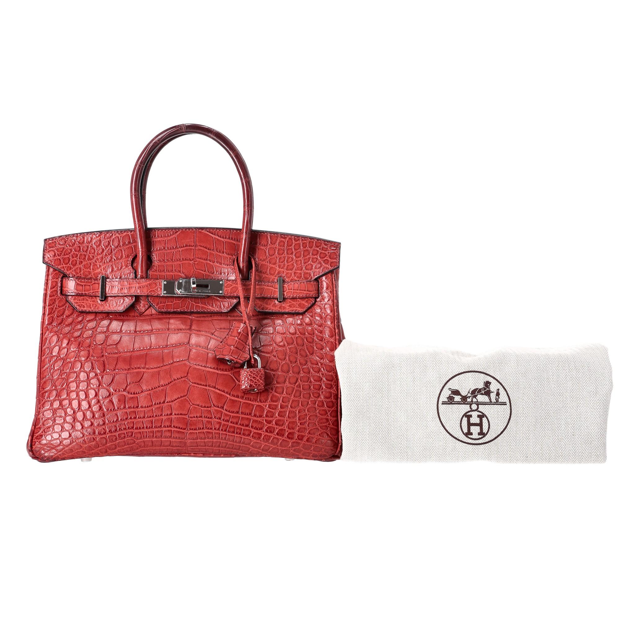 Hermes Birkin 30 Alligator Mississippiensis Skin Handbag

Sanguine/red tone, matte coloured exotic skin bag.

Palladium hardware with 'Hermes Paris' engravement and signature belted strap closure.

Clochette, keys, padlock. From 2008. 

Size -