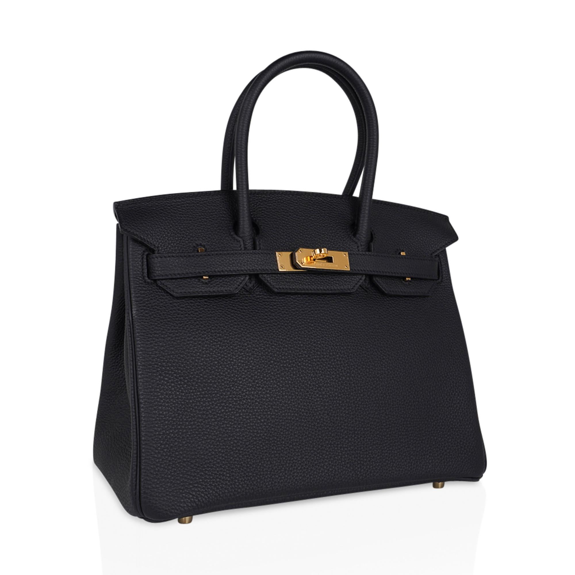 Mightychic offers an Hermes Birkin 30 bag featured in Black Togo leather.
Coveted with gold hardware.
Togo leather is supple and highly scratch resistant.
Comes with lock and keys and clochette, sleepers, raincoat and signature Hermes box.
NEW or