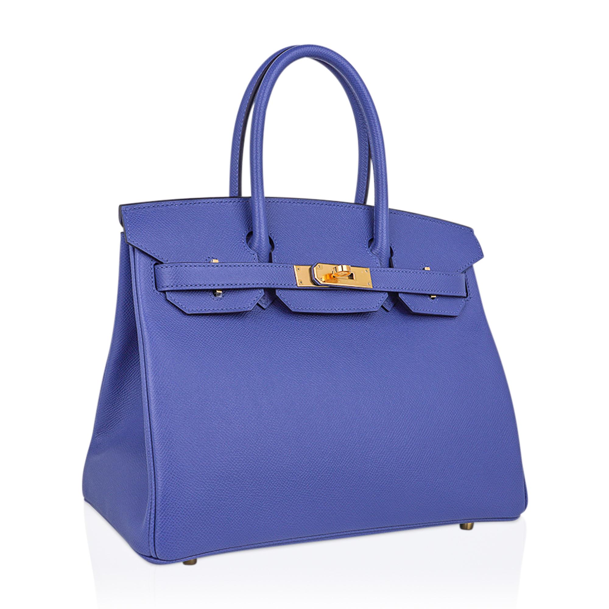 Mightychic offers an Hermes Birkin 30 bag featured in rare Bleu Brighton.
This stunning blue has a soft lavender undertone and will remind you of a beautiful periwinkle.
This sought after Hermes Birkin bag is exquisite in Epsom leather.
Accentuated