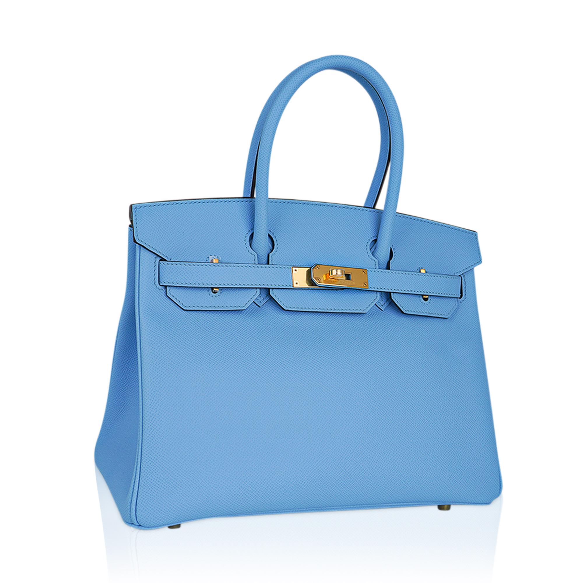 Mightychic offers an Hermes Birkin 30 bag featured in rare Blue Celeste.
This beautiful sky blue Birkin bag is accentuated with Gold hardware.
Neutral and as stunning in winter as she is in summer.
Epsom leather which lends rich saturation of