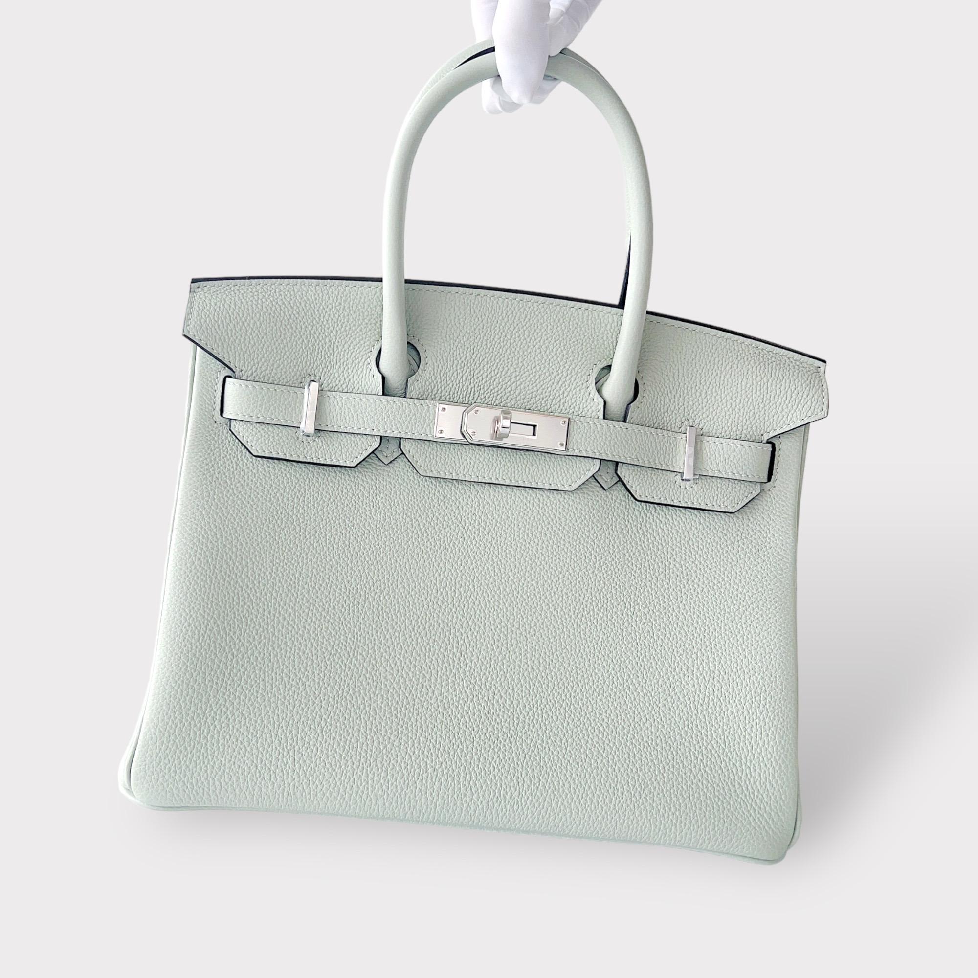 Shop this elegant Hermes Birkin 30 In Gris Neve with Palladium Hardware. It is unused in pristine condition, purchased in 2023. This Birkin 30 comes in Gris Neve, which is a new colour for Spring / Summer 2023. It is the perfect colour to match with