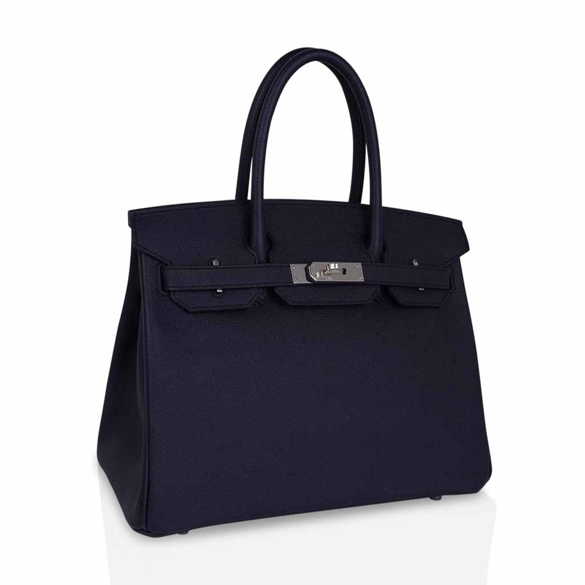 Mightychic offers a rich Hermes Birkin 30 bag featured in Bleu Indigo.
This rich deeply saturated dark blue iBirkin bag s a timeless classic.
Crisp with palladium hardware.
Classic and timeless this beautiful Hermes bag takes you from to evening in