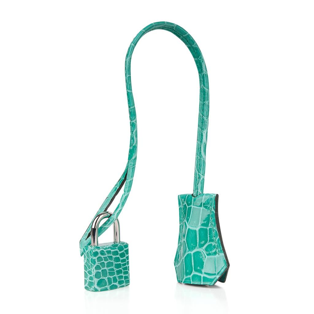 Guaranteed authentic Hermes Birkin 30 bag features exquisite and breathtaking Jade in Porosus Crocodile.  
Show stopping and over the top fabulous!
This rare and beautiful Hermes Birkin has exceptional scales. 
Accentuated with Palladium hardware.