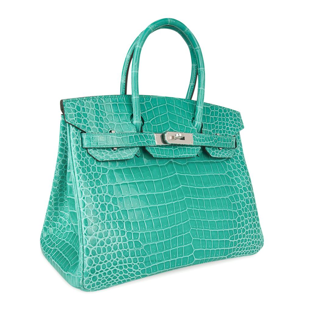 Mightychic offers an Hermes Birkin 30 bag features exquisite and breathtaking Jade in Porosus Crocodile.  
Show stopping and over the top fabulous!
This rare and beautiful Hermes Birkin has exceptional scales. 
Accentuated with Palladium hardware.