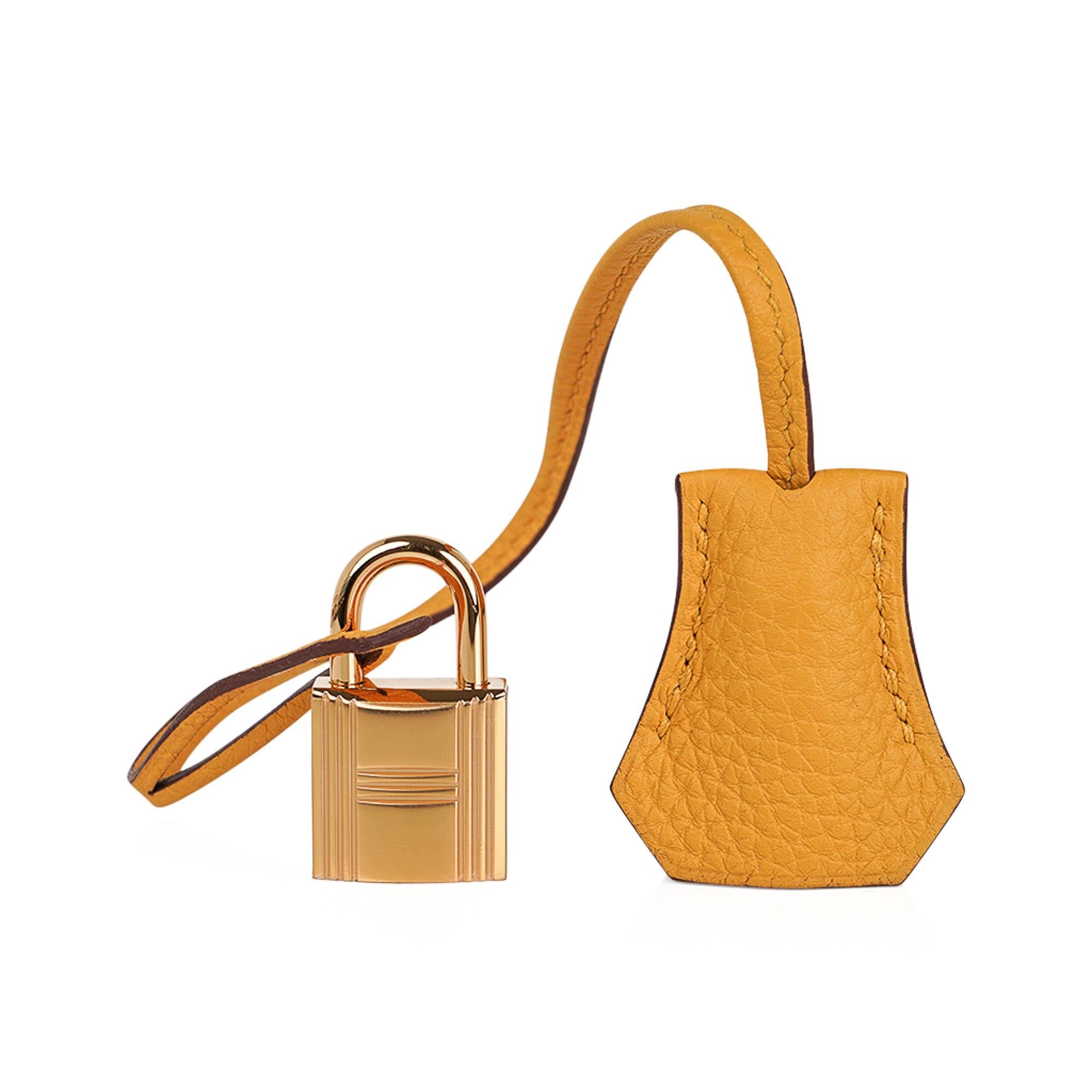 Mightychic offers a guaranteed authentic Hermes Birkin 30 bag featured in warm Jaune Ambre yellow.
Accentuated with gold hardware.
Neutral with a pop of colour, this beautiful Hermes Birkin bag is great for year round wear.
Togo leather is supple to