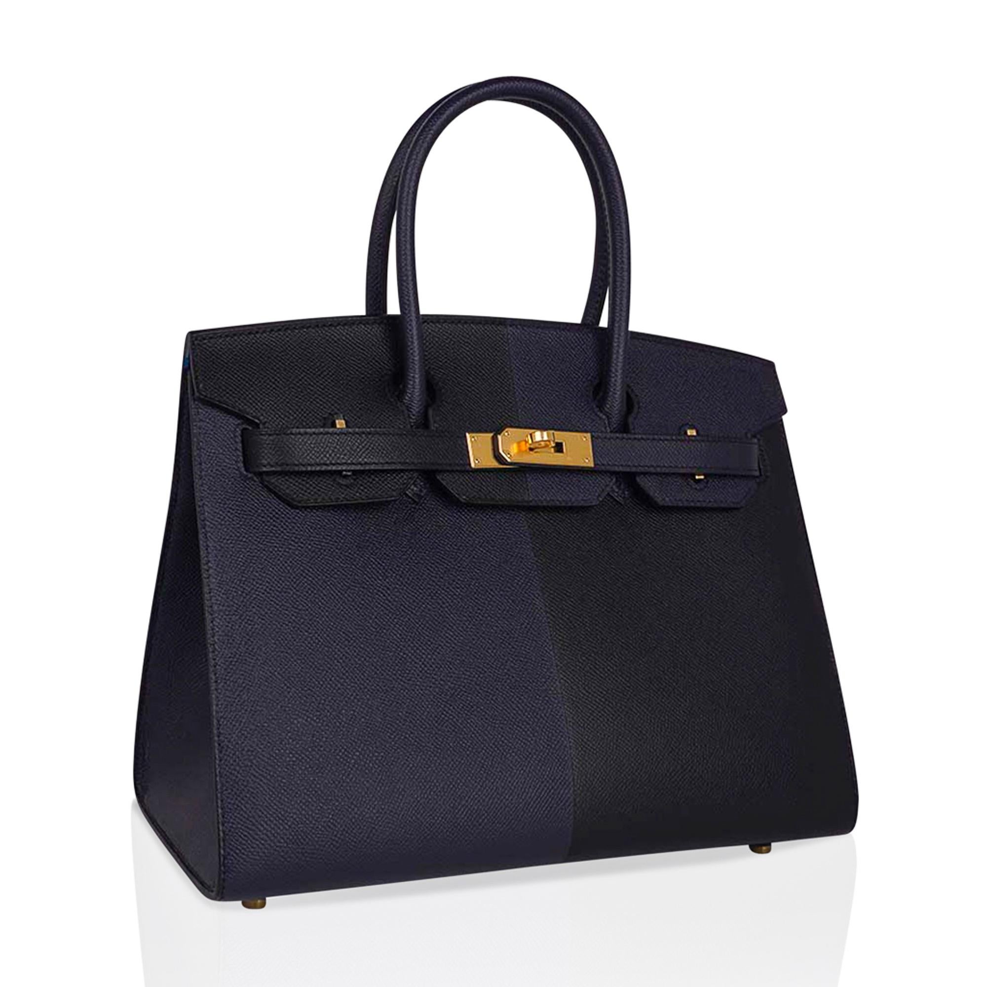 Mightychic offers a limited edition Hermes Birkin Sellier Casaque 30 tri-colour bag featured in Black and Blue Indigo.
Vivid Bleu Frida interior.
Beautiful and exotic, this epsom leather Hermes Birkin Sellier limited edition bag is perfect for year