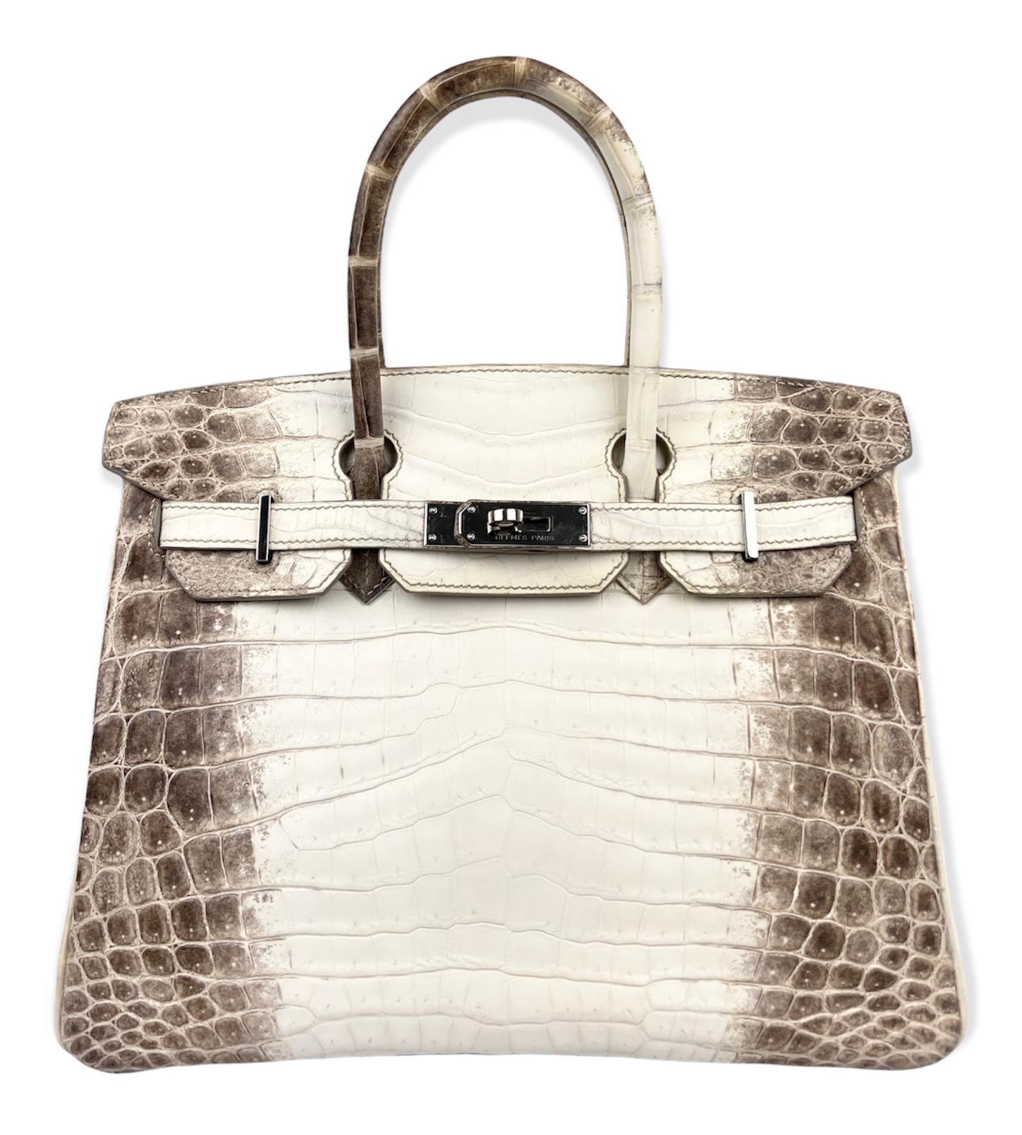 Absolutely Stunning Holy Grail and Rarest Handbag in the World! Hermes Birkin 30 Bag Matte White Himalaya Niloticus Crocodile Palladium Hardware. Excellent a condition with Plastic on Hardware. Includes Cites.


Shop with Confidence from Lux