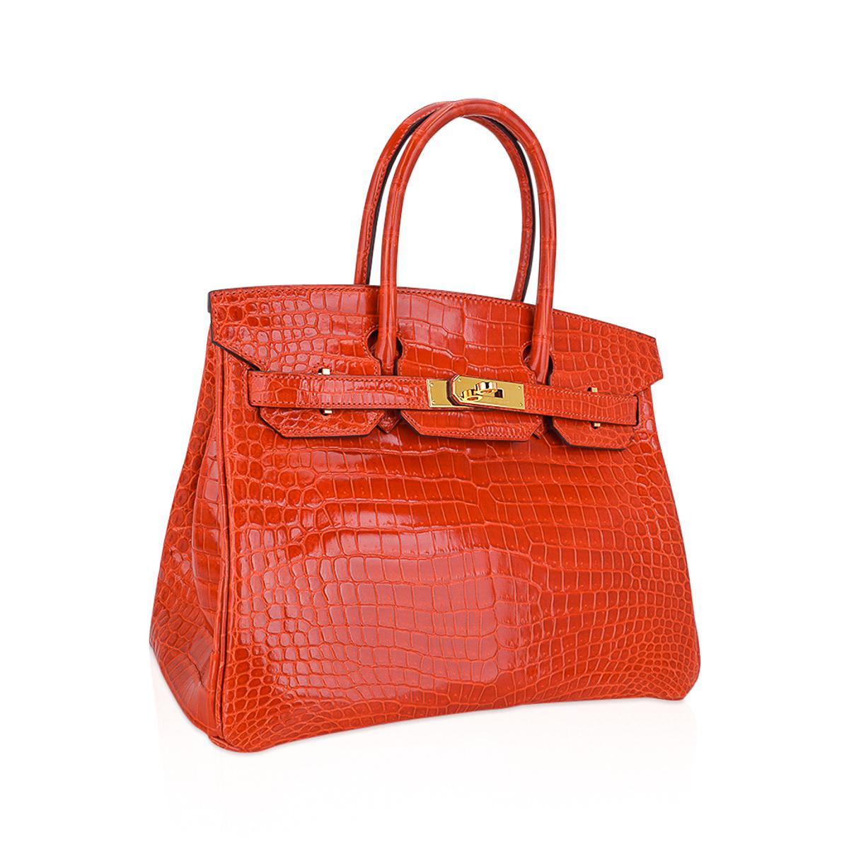 Mightychic offers an Hermes Birkin 30 bag is featured in Orange Poppy Porosus Crocodile. 
This vibrant Orange Hermes Birkin bag in crocodile lisse skin with lush gold hardware is magnificent with beautiful scales!
Clean body, handles, corners and