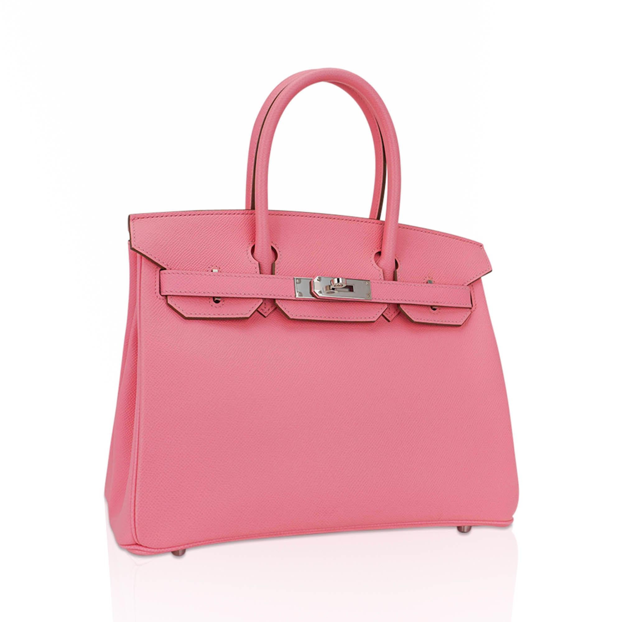 Mightychic offers an Hermes Birkin 30 bag featured in coveted Rose Confetti.
This exquisite Pink hue is rarely found today, and is an Hermes collectors dream!
Epsom leather with crisp Palladium hardware accentuates the beautiful colour of this
