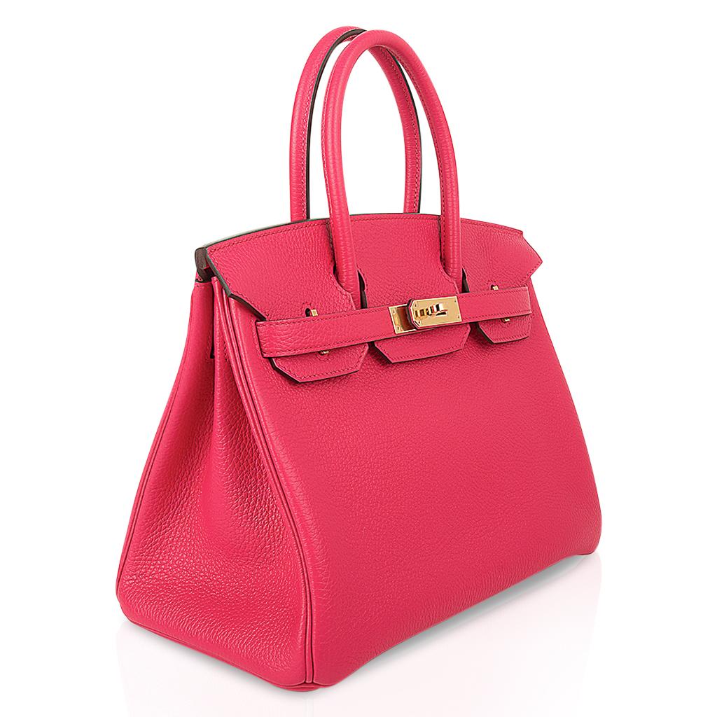 Mightychic offers an Hermes Birkin 30 bag featured in vibrant Rose Extreme.
This exquisite pink has a fabulous depth of color.
Lush with Gold hardware. 
Clemence leather. 
This beauty will take you year round.
Comes with the lock and keys in the