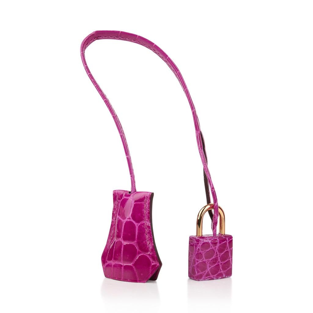 Mightychic offers a guaranteed authentic Hermes Birkin 30 bag featured in vivid Rose Scheherazade Crocodile Lisse. 
The most exquisite scales create this show stopping and over the top fabulous bag. 
Accentuated with gold hardware. 
This perfect