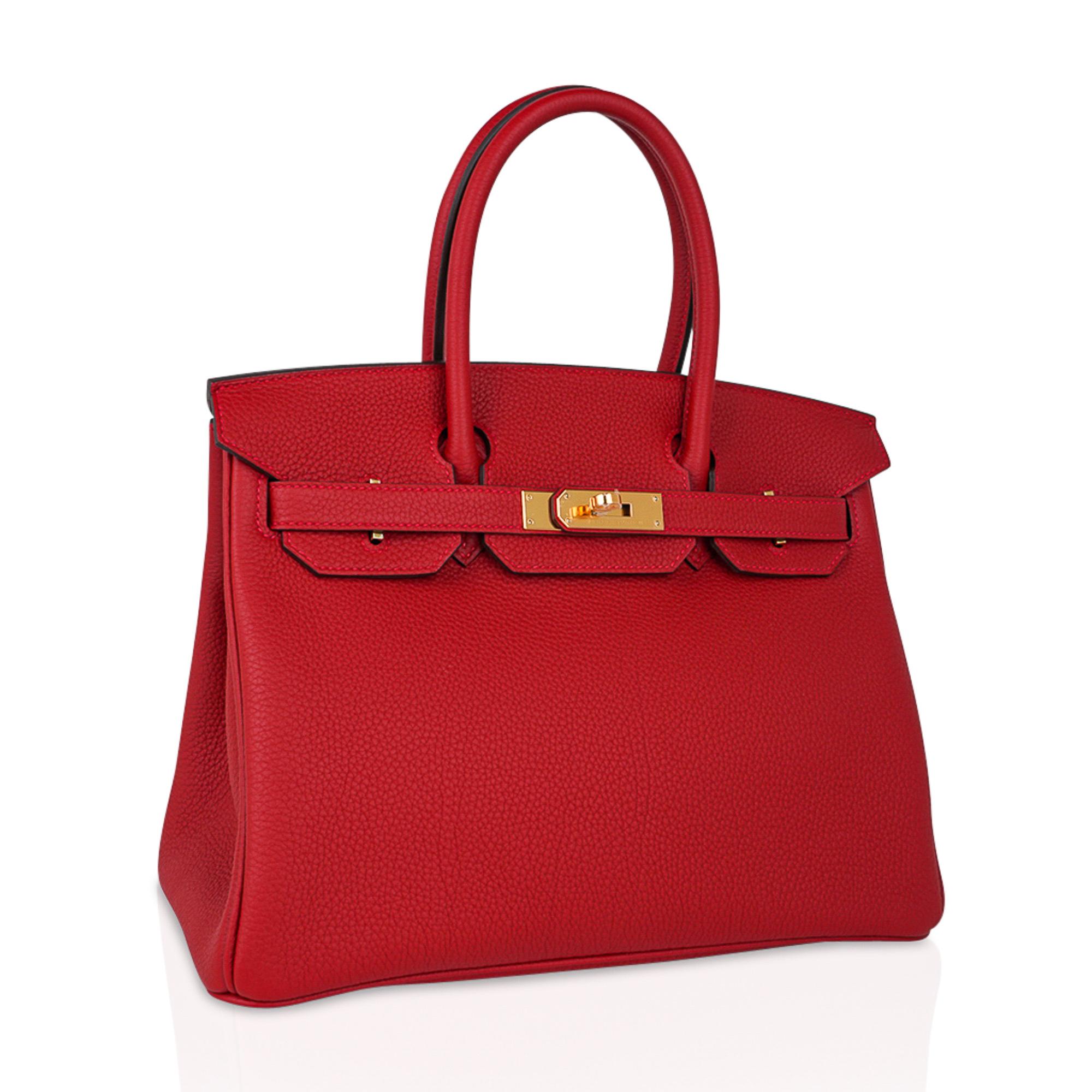Mightychic offers an Hermes Birkin 30 in rich and exquisite lipstick red Rouge Vif.
Signature pink top stitch.
Coveted gold hardware and togo leather.
Comes with lock and keys and clochette, sleepers and signature orange Hermes box.
NEW or NEVER