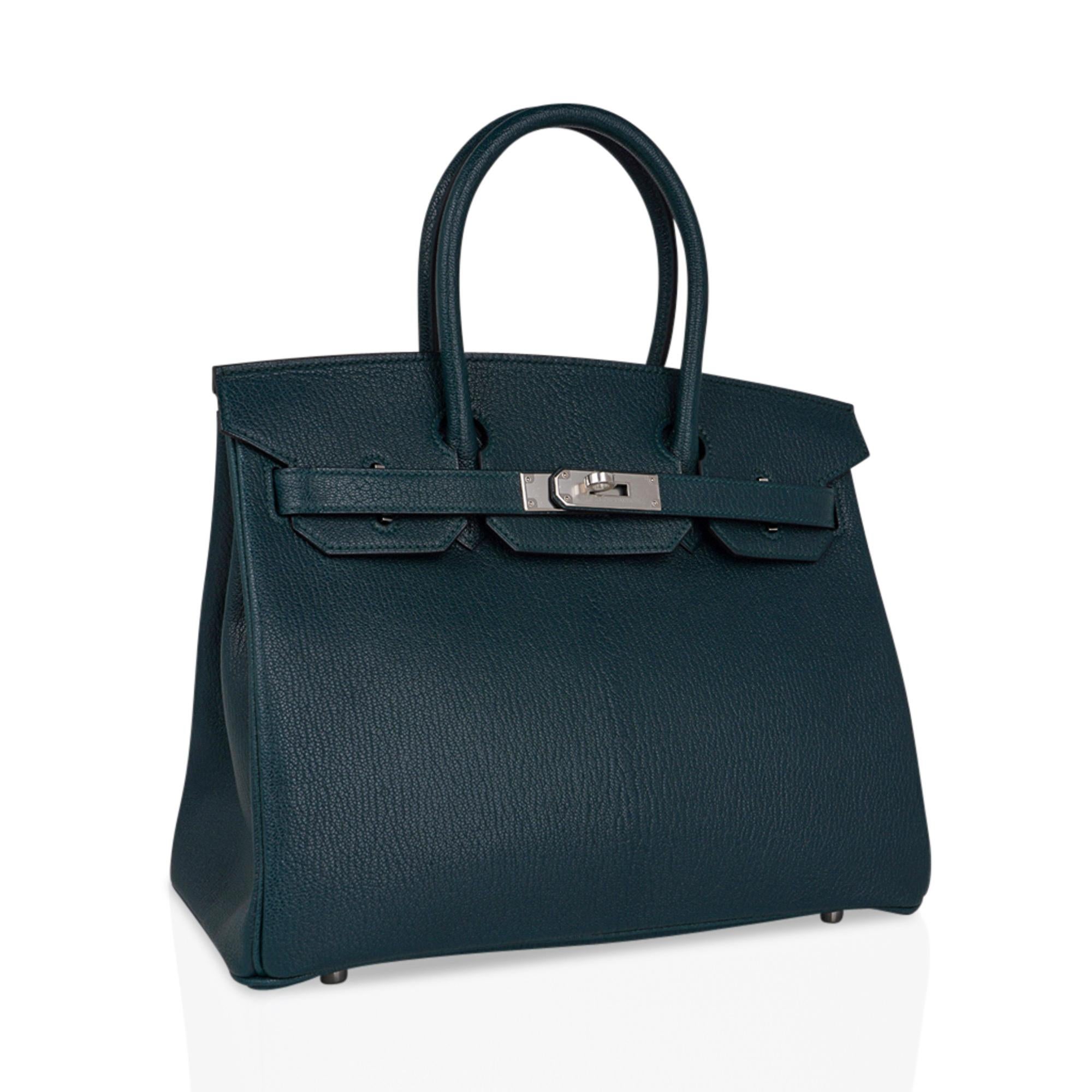 Mightychic offers an Hermes Birkin 30 bag featured in Vert Cypress.
Rare Chevre de Coromandel leather accentuates the beauty of this rich deep color.
Fresh with Palladium hardware.
Perfect for year round wear.
Comes with lock, keys, clochette,