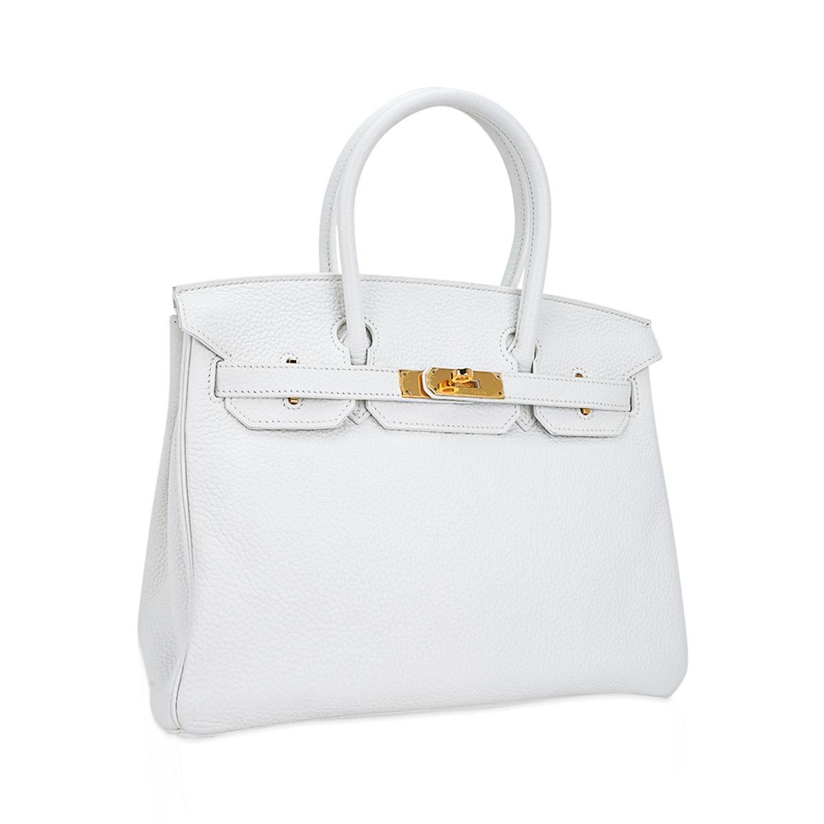 Mightychic offers an Hermes Birkin 30 bag featured in coveted White.
The most rare of all Hermes leather colours.
Accentuated with gold hardware.
This snow white Hermes Birkin bag is in clemence leather.
Never worn, there is one small light mark on