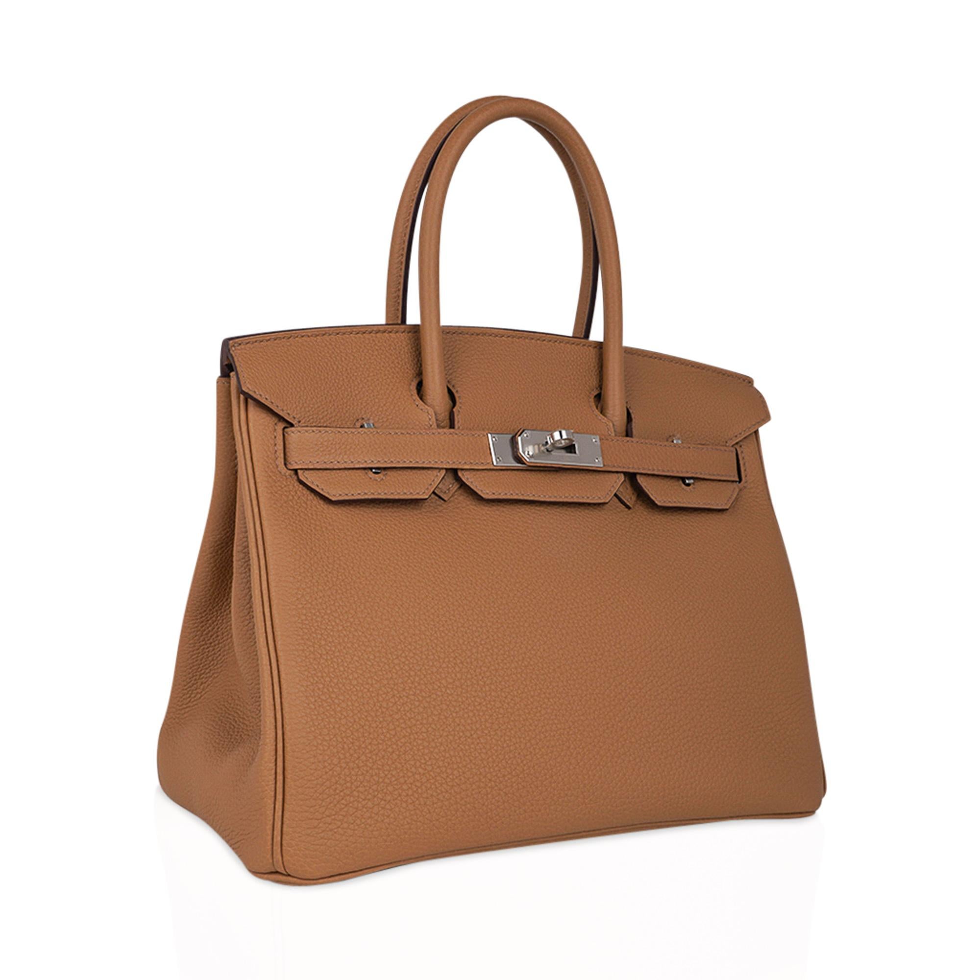 Mightychic offers an Hermes Birkin 30 bag featured in warm Biscuit.
Togo leather with fresh palladium hardware accentuates the beautiful colour of this Birkin bag.
This beauty will take you year round.
Comes with the lock and keys in the clochette,