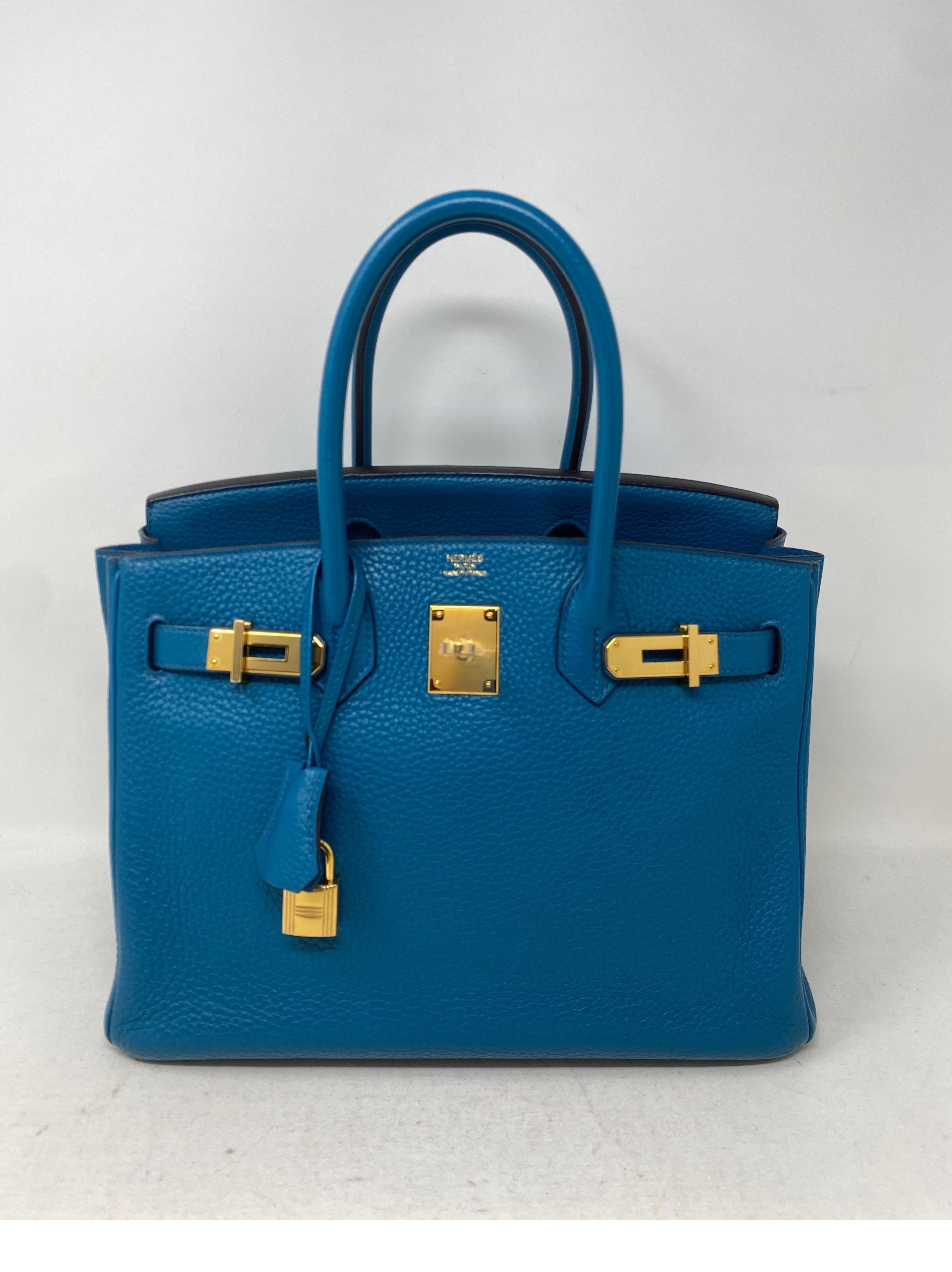 Hermes Blue Cobalt Birkin 30 Bag. Excellent condition. Blue clemence leather. Gold hardware. Still has plastic on hardware. Interior clean. R stamp. Includes clochette, lock, keys, and dust bag. Guaranteed authentic. 