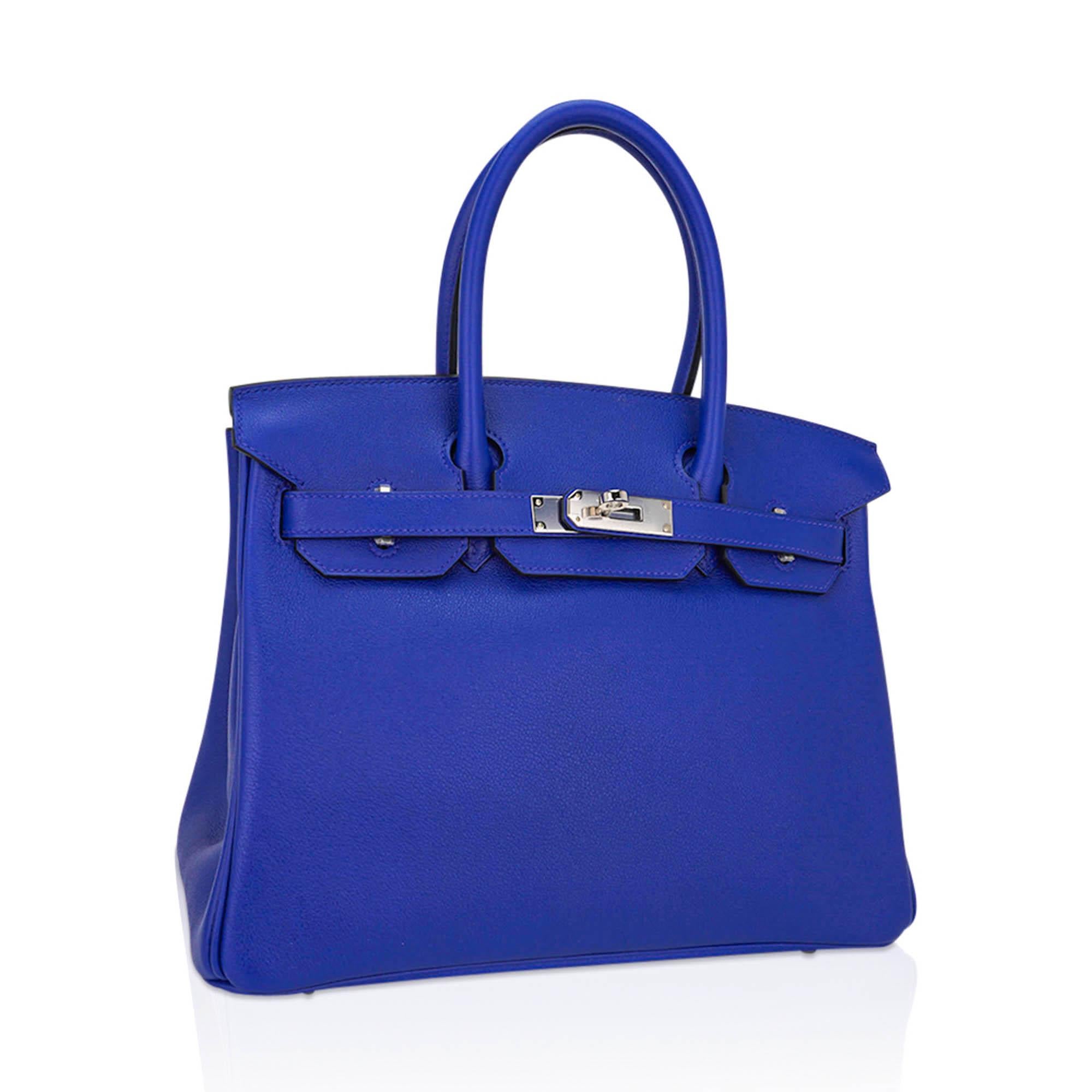 Mightychic offers an Hermes Birkin 30 bag featured in vivid Blue Electric.
This brilliant Bleu Electrique Birkin bag in supple Novillo leather is exquisitely accented with crisp palladium hardware.
Comes with the lock and keys in the clochette,