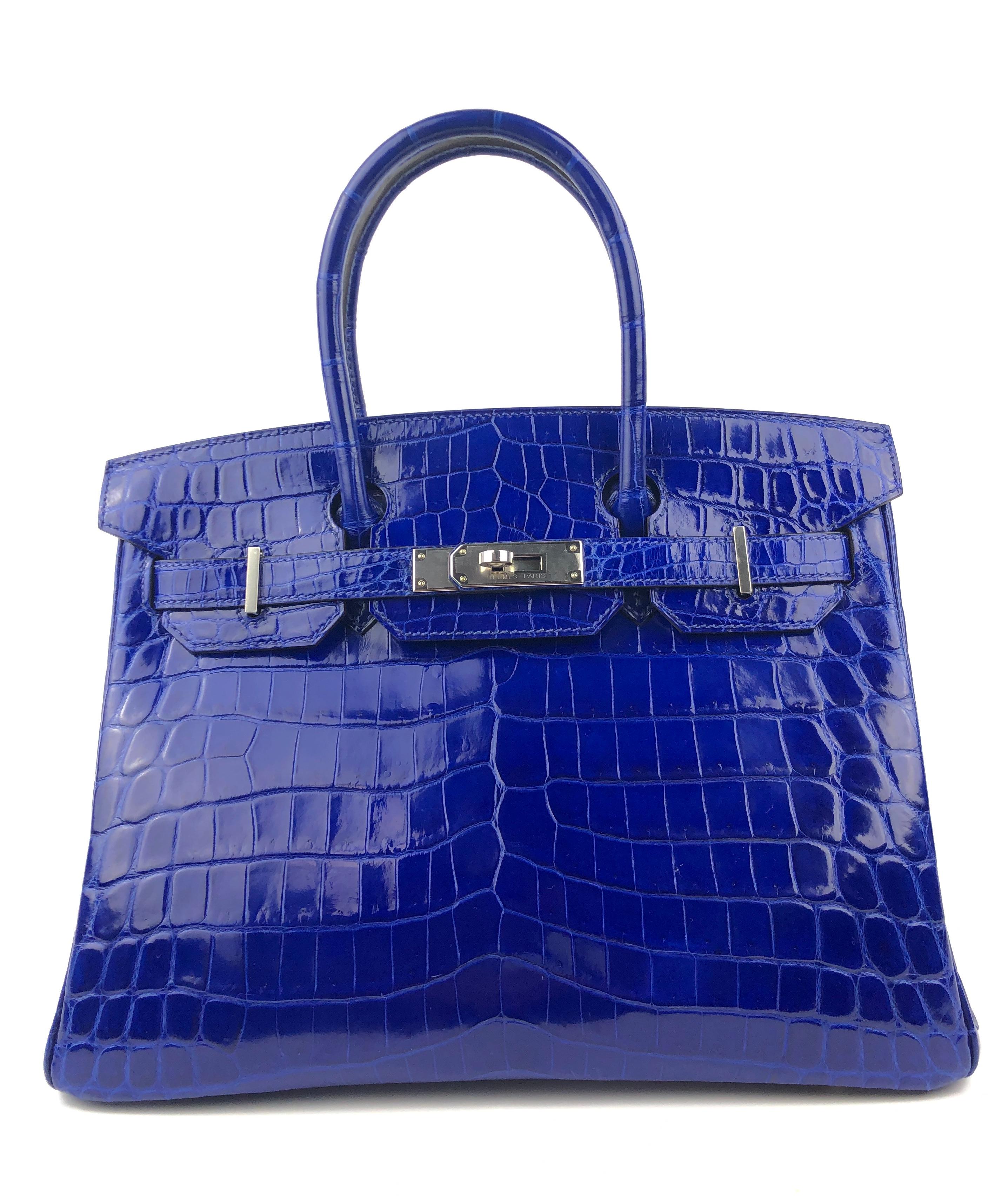 Stunning Hermes Birkin 30 Blue Electric Shinny Niloticus Crocodile Palladium Hardware. Excellent Condition, Plastic on Hardware, Perfect corners and Structure. Q Stamp 2013.

Shop with Confidence from Lux Addicts. Authenticity Guaranteed!