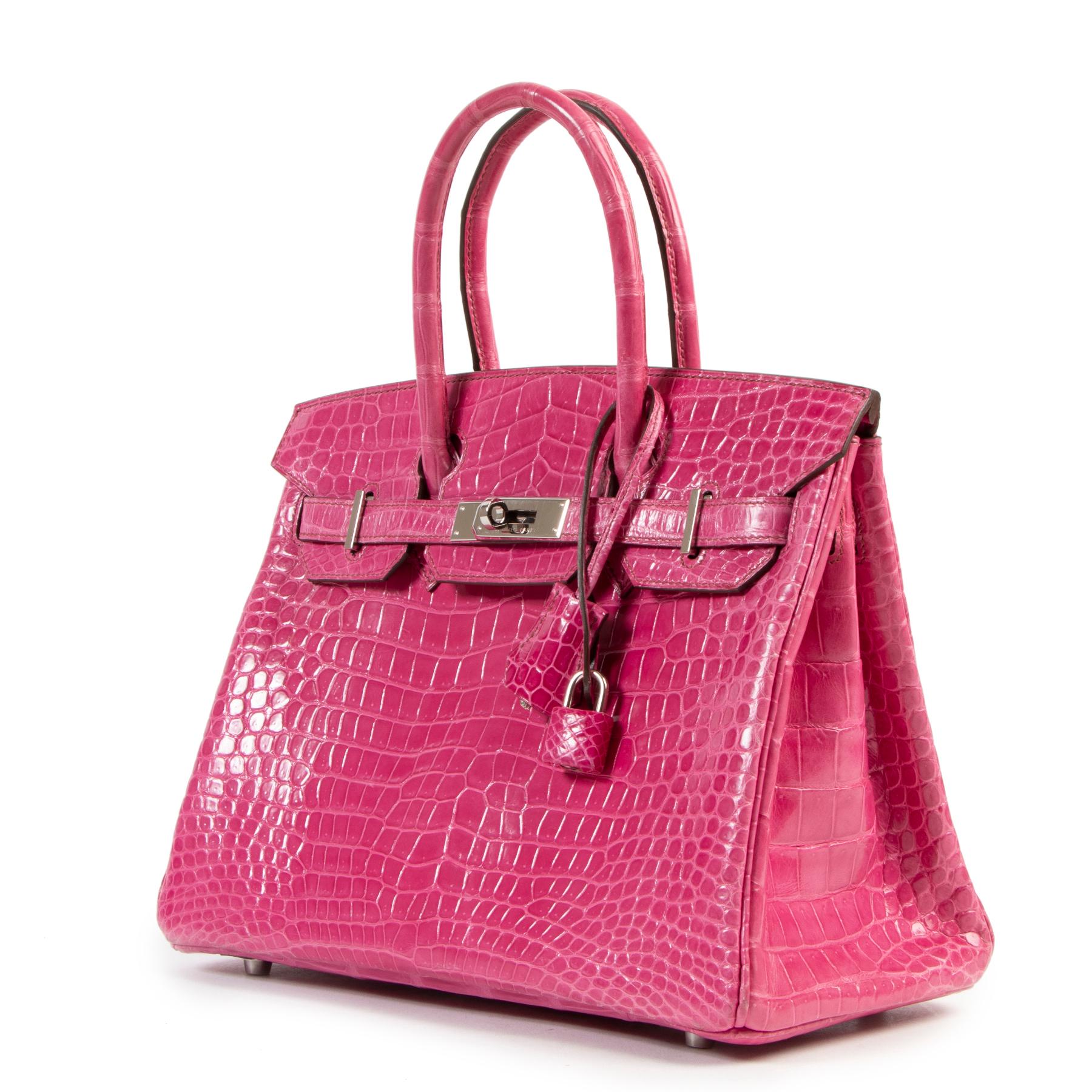 Hermès Birkin 30 Croco Porosus Lisse Fuchsia PHW

This extremely rare and precious Hermès Birkin 30 Croco Porosus Lisse Fuchsia truly is the height of luxury. Its bright fuchsia hue is the perfect shade of pink, whilst the impeccable crocodile