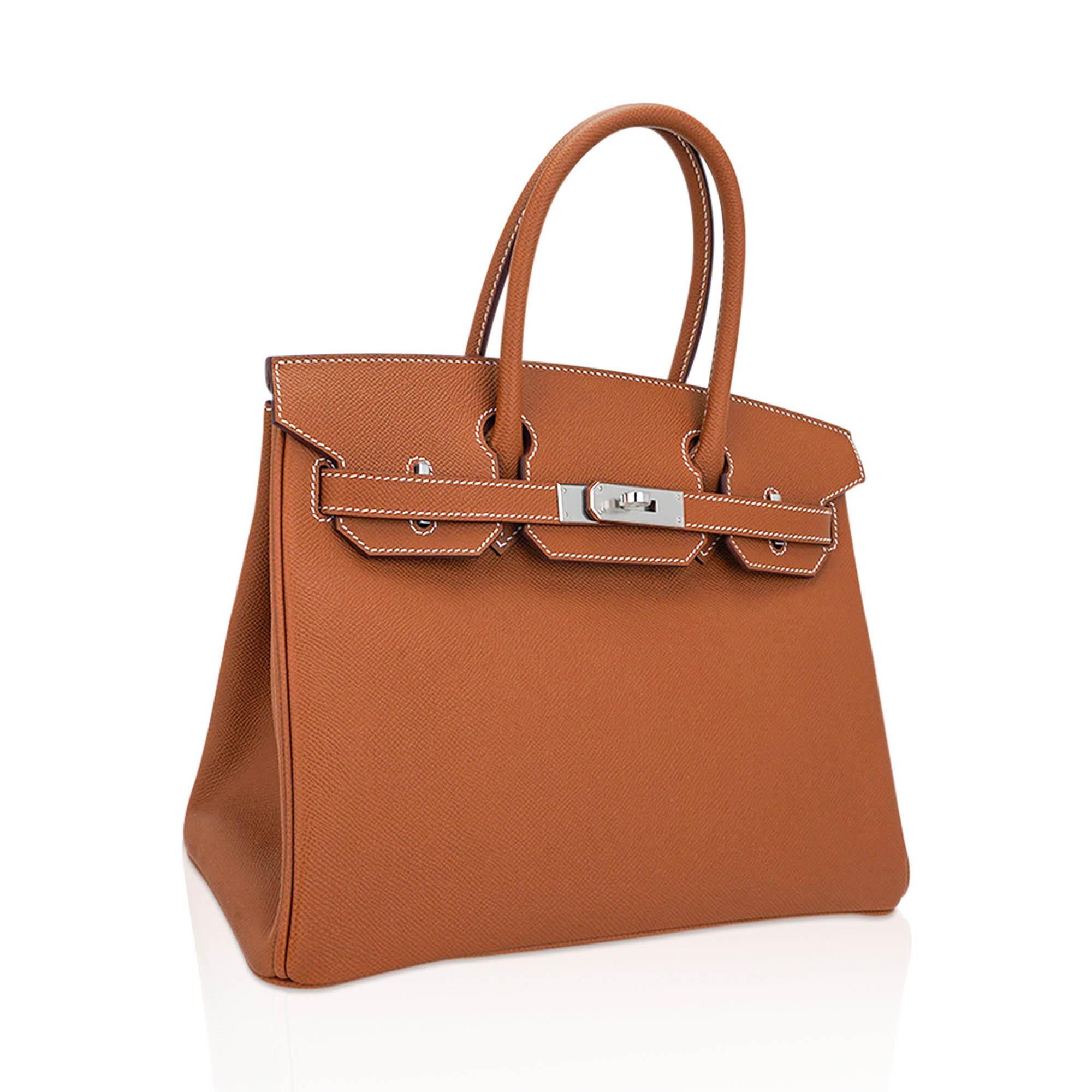 Mightychic offers an Hermes Birkin 30 bag featured in iconic Gold.
Fresh and crisp with Palladium hardware.
Accentuated with signature bone top stitch. Epsom leather is light in weight and maintains the shape of the bag beautifully.
Comes with lock,