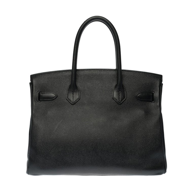 Stunning and Rare Hermes Birkin 30 cm handbag in black Epsom leather , Palladium silver metal , double handle in black leather allowing a handheld.

Closure by flap.
Lining in black leather, a zipped pocket, a patch pocket.
Signature: 