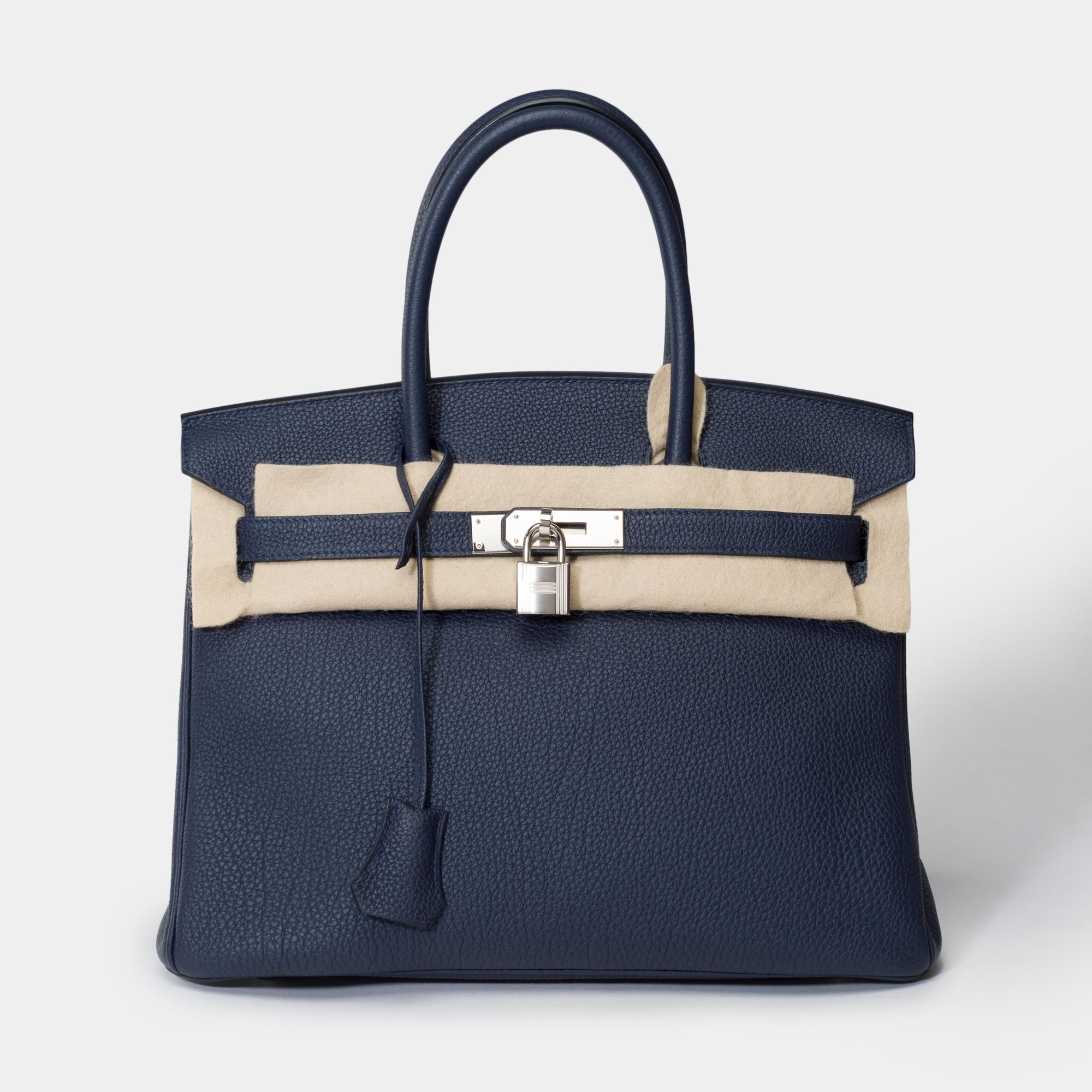Amazing​ ​Hermes​ ​Birkin​ ​30​ ​handbag​ ​in​ ​Bleu​ ​nuit​ ​Togo​ ​leather​ ​,​ ​palladium​ ​silver​ ​plated​ ​metal​ ​trim,​ ​double​ ​handle​ ​in​ ​blue​ ​leather​ ​allowing​ ​a​ ​hand​ ​carry

Flap​ ​closure
Blue​ ​leather​ ​inner​ ​lining​ ​,​